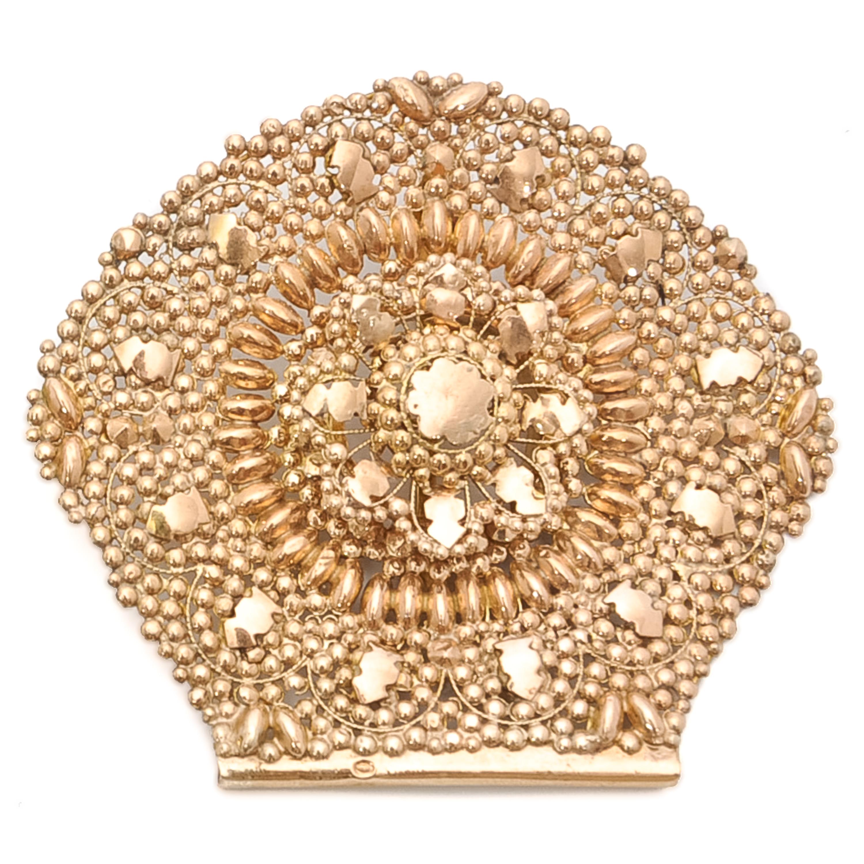 These antique 19th century 14 karat gold jewels are created with granulation and cannetille. The design of these antique pieces consists of many tiny balls (granules) which are applied on the whole surface, stamped with gold convex motifs. The