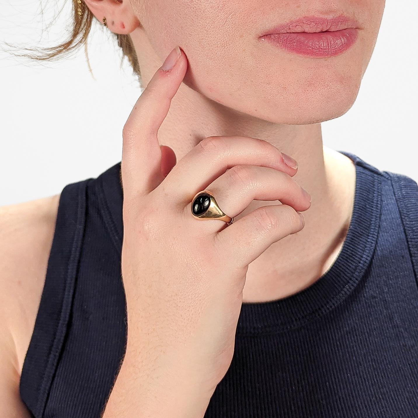 A very fine antique gold and garnet signet style ring.

Set with a large, dark oval garnet cabochon in 14k gold.

Simply a terrific ring!

Date:
20th Century

Overall Condition:
It is in overall good, as-pictured, used estate condition with some