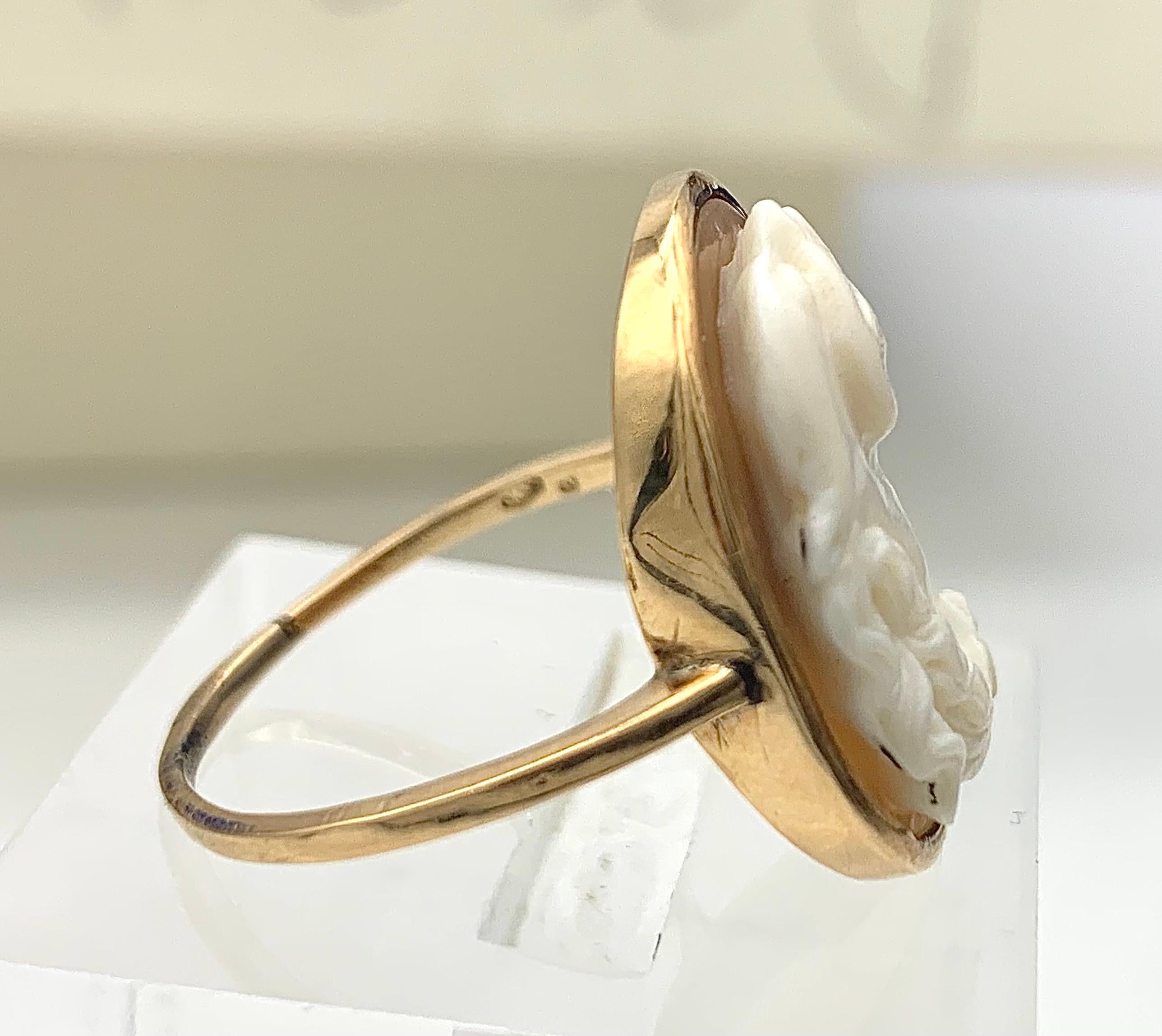 This ring was made in 1870-1880 ca. The cameo is carved out of a shell and ounted in a 14 karat gold setting. The subject of the cameo is the Greek hero Hercules,  carved as a bust in profile wearing a lion skin. 
Hercules or Heracles, his geek