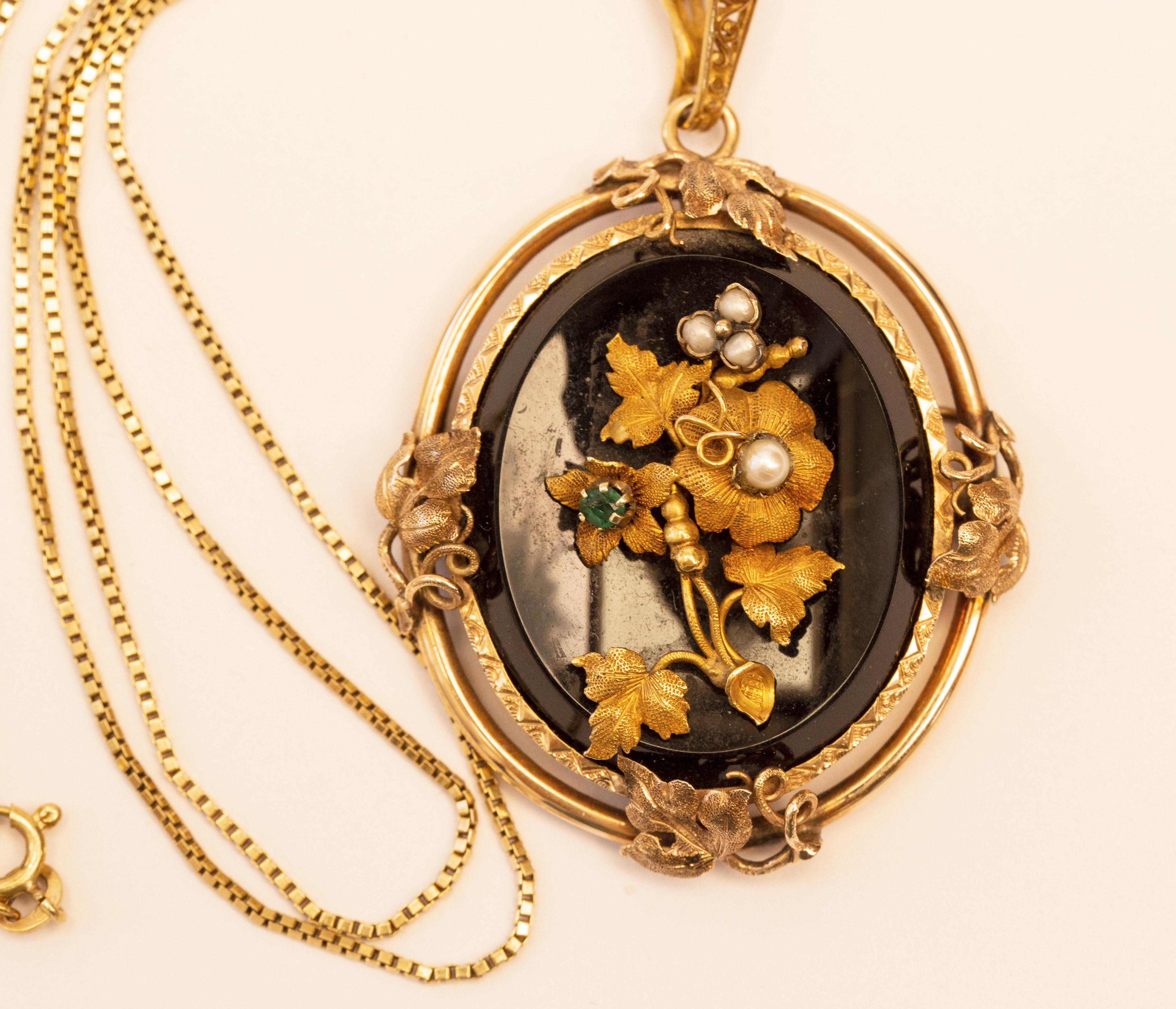 Victorian Antique 14 Karat Oval Onyx Pendant with Floral Emerald Pearl & Gold Decoration  For Sale