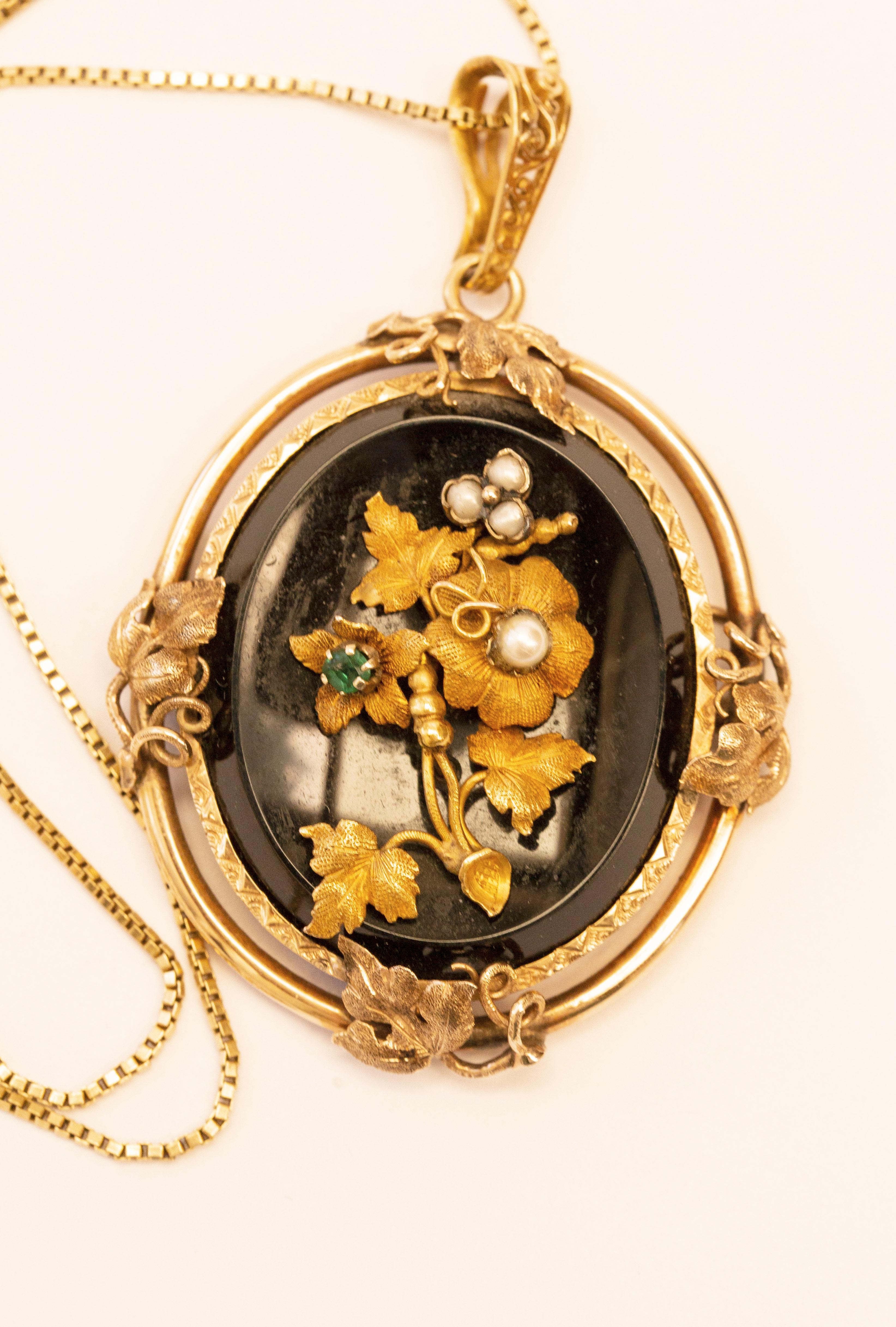 Oval Cut Antique 14 Karat Oval Onyx Pendant with Floral Emerald Pearl & Gold Decoration  For Sale