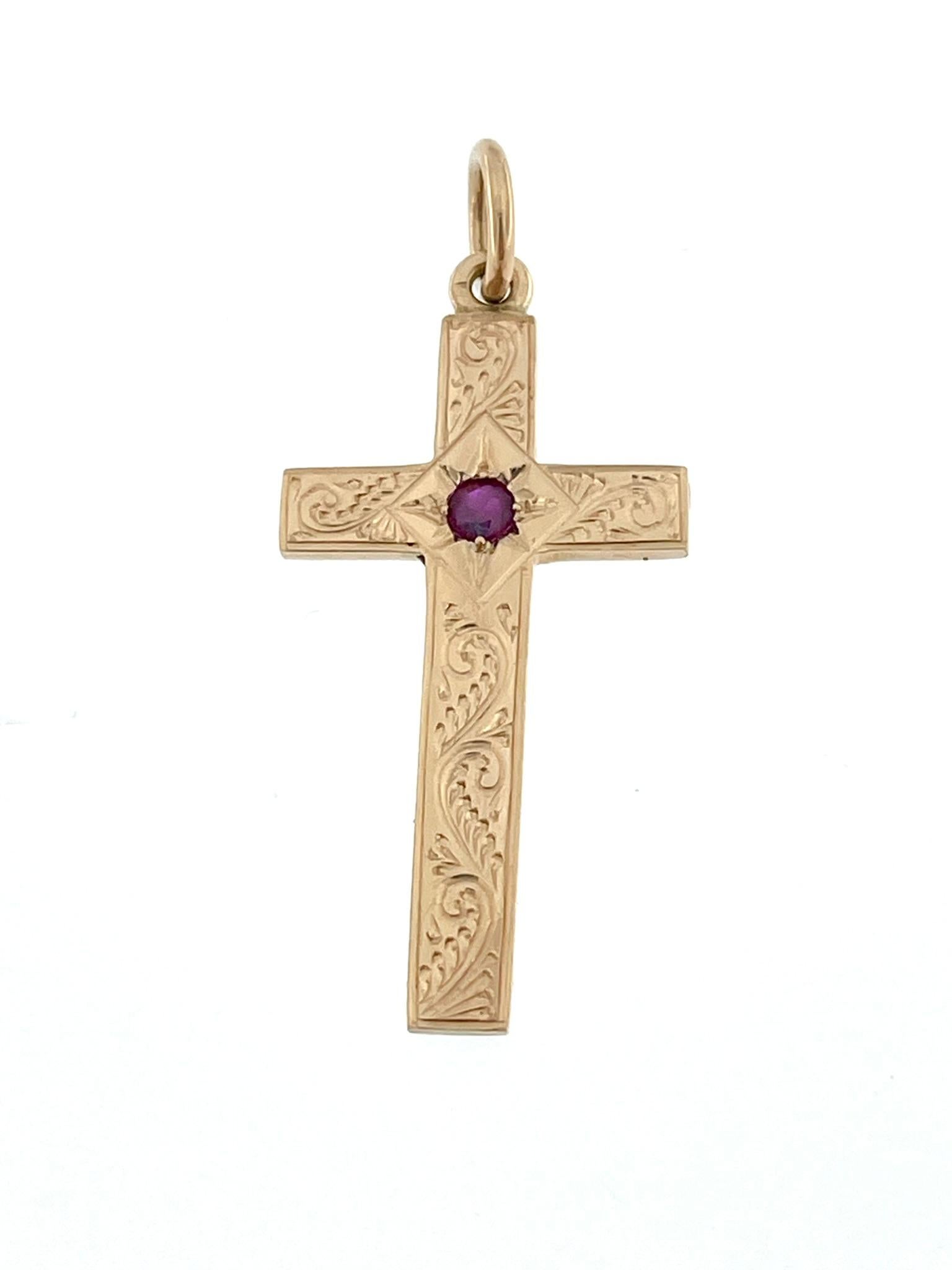 The Antique 14 karat Ruby German Cross is a captivating and historically rich religious pendant that showcases intricate craftsmanship and a unique design. This vintage piece features a central ruby as its focal point, surrounded by detailed relief