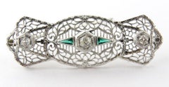 Antique 14 Karat White Gold Art Deco Diamond and Emerald Filigree Brooch Pin