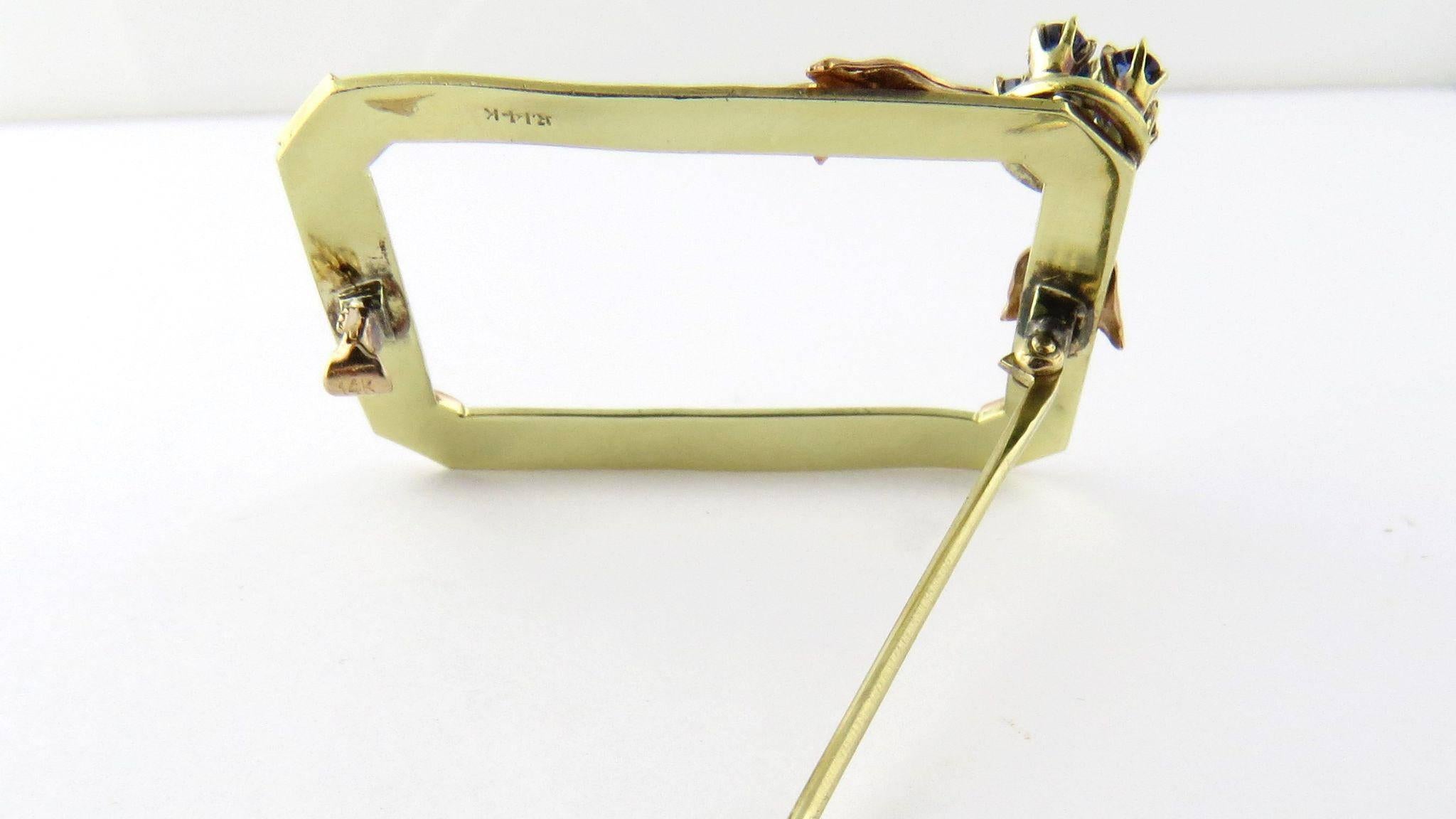 Antique 14K Yellow And Rose Gold Sapphire Frame Brooch 

This beautiful brooch looks like a picture frame ready to showcase a beautiful scarf or sweater. 

The frame is made of yellow gold with rose gold edges. 

On the corner is a flower made of