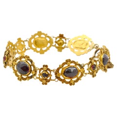 Antique 14 Karat Yellow Gold Cannetille and Garnet Link Bracelet