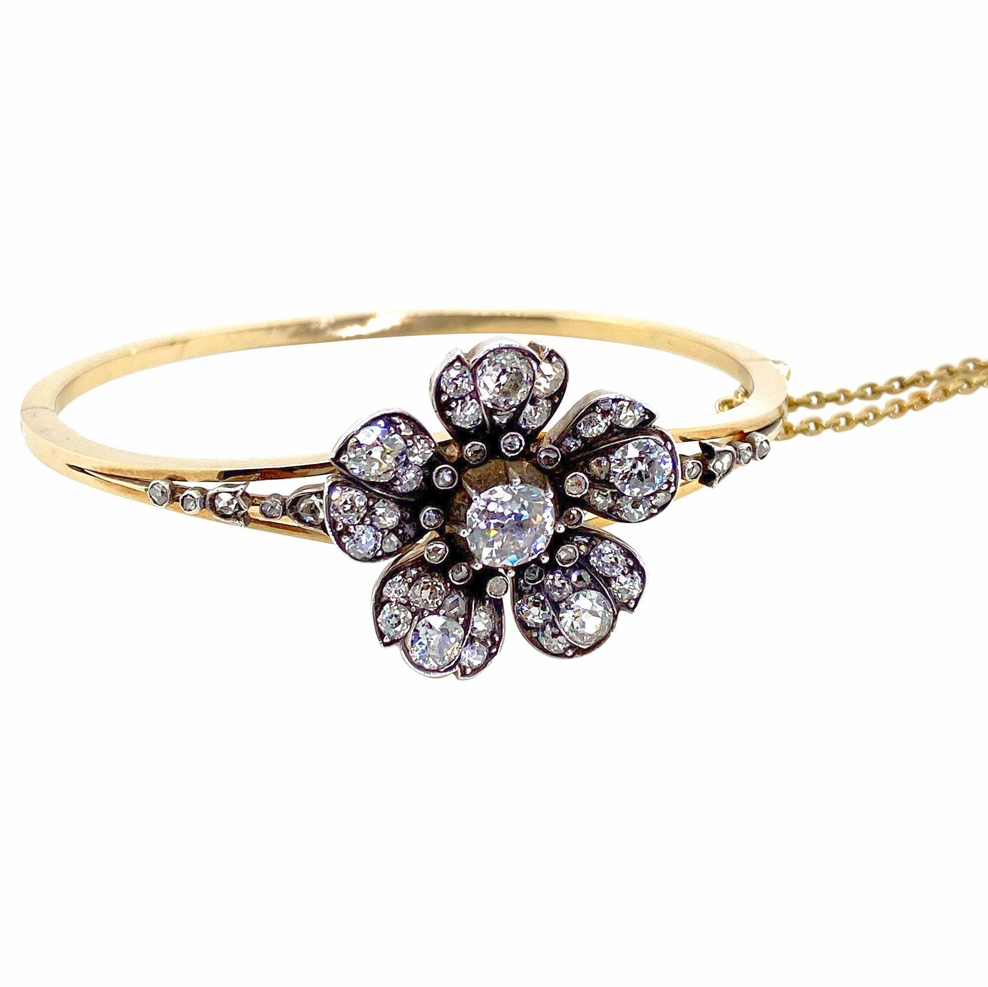 Flowers are always beautiful to receive as a gift, but why not give flowers that are everlasting! Diamond flowers of course, what could be better? This antique bangle is a pretty jewel in every sense. From the delicate flower head to the finely