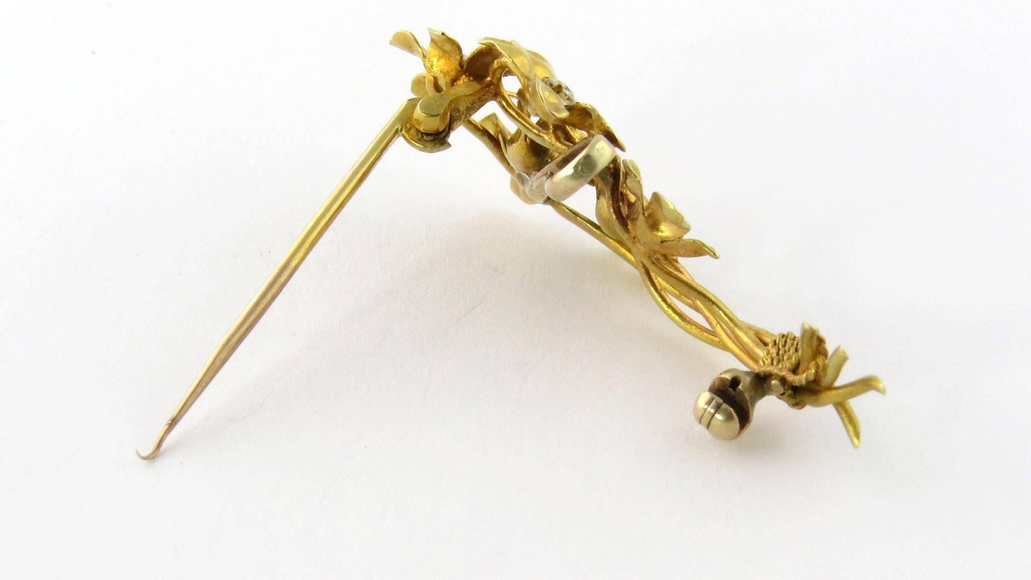 Antique 14K Yellow Gold Diamond Flower Bouquet Brooch Pin. 

Beautiful bouquet of gold flowers each centered with a pronged diamond and surrounded with 5 pinched petals. Gold roping wraps up the four stems at the bottom. 

Chatalaine hook for