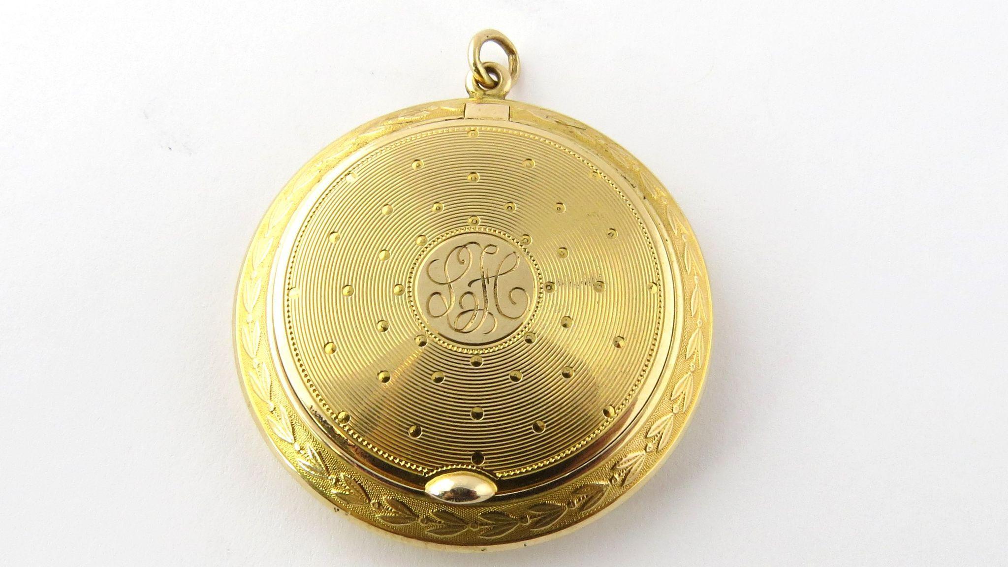 Antique 14K Yellow Gold Locket / Compact Snuff Box Pendant with Engine Turned Design circa 1900 - 1910

Front cover has monogram engraved LFC - this could be removed if requested 

1 11/16