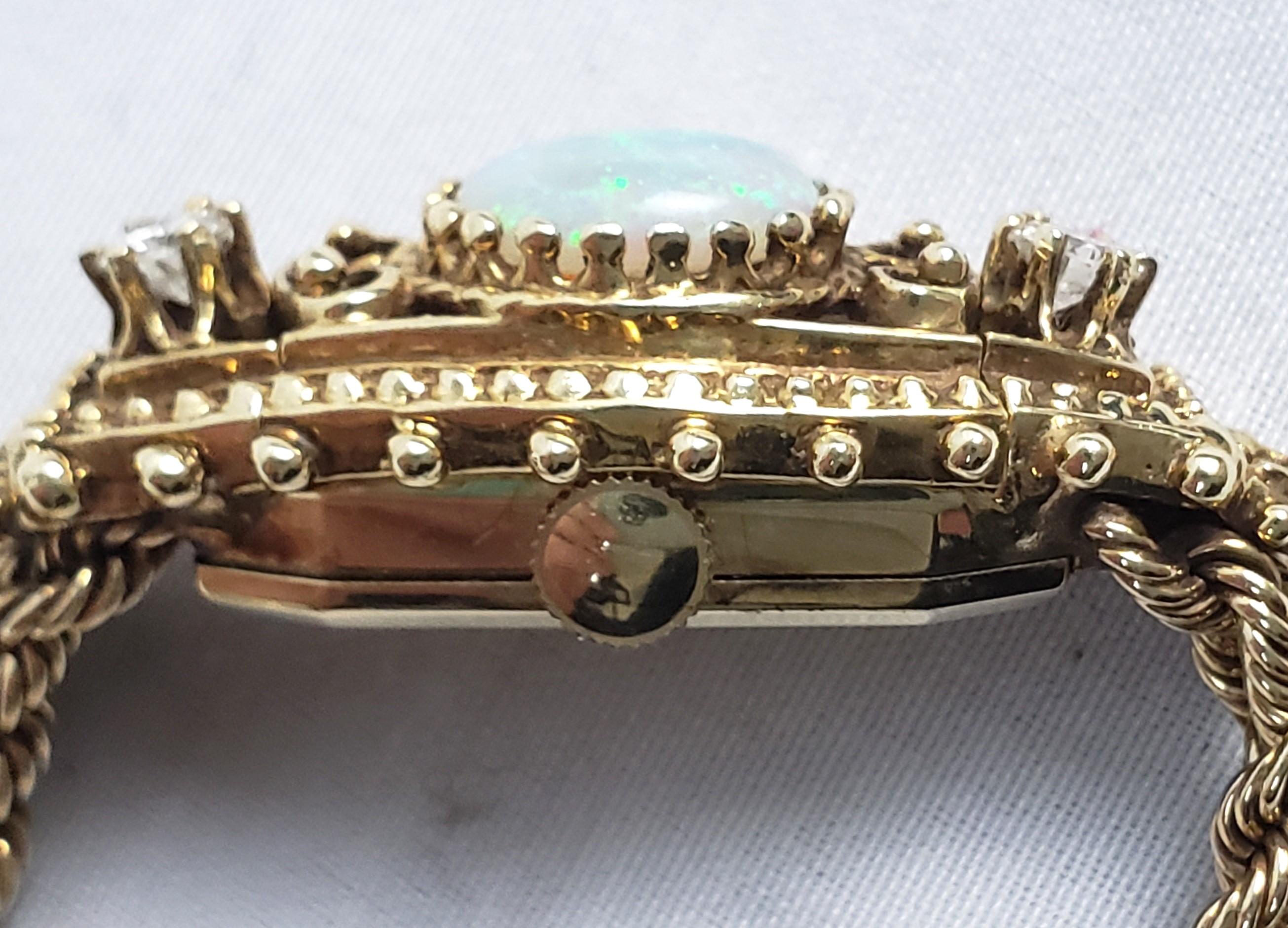 Swiss Antique 14 Karat Yellow Gold Peek A Boo Ladies Wristwatch with Opal and Diamonds For Sale