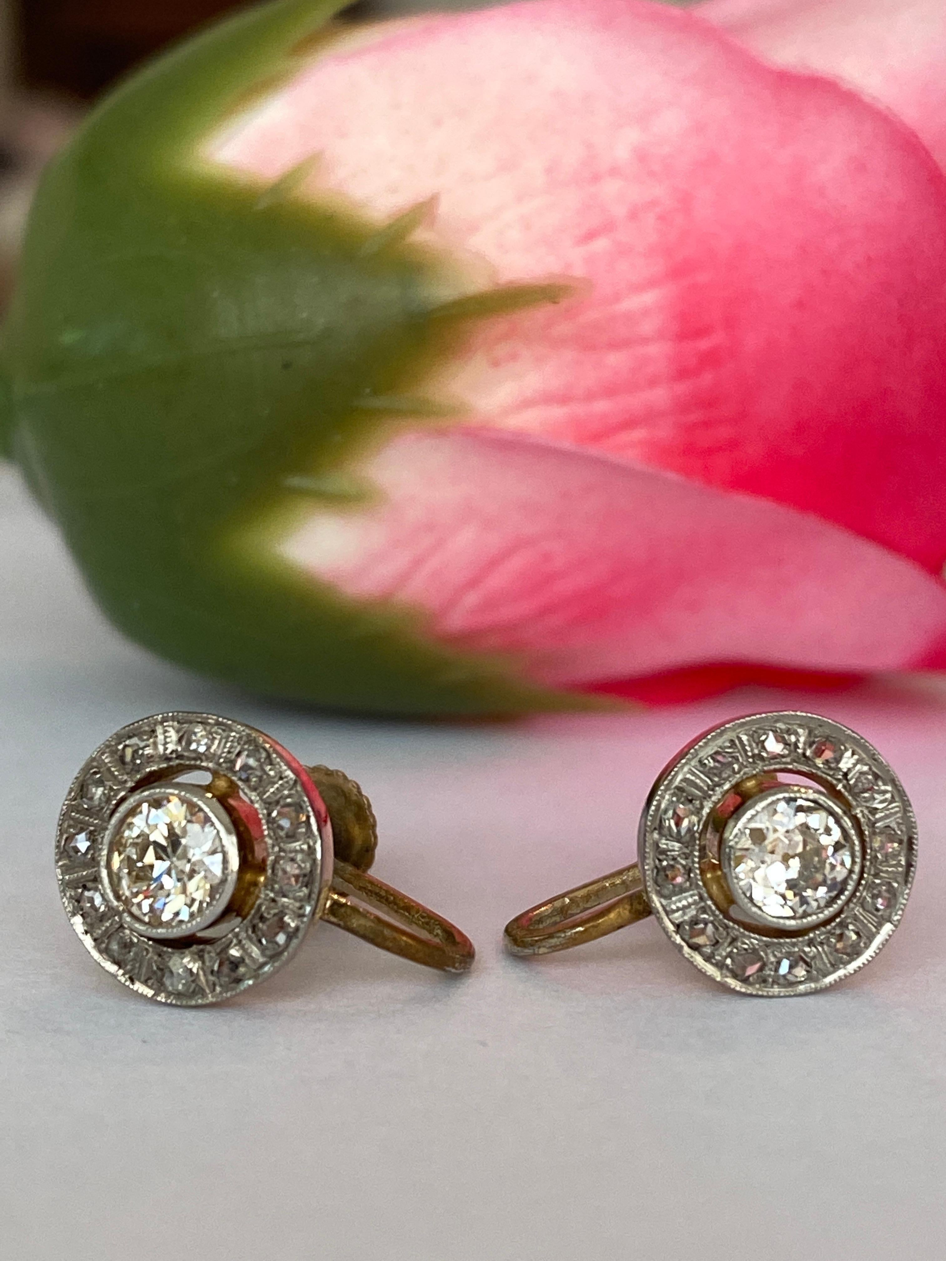 Timeless and elegant, these antique halo earrings are crafted in 14kt yellow gold and showcase a pair of captivating Bolshevik-cut diamonds at their center. Each diamond, hand-cut in the late 19th to early 20th century, displays the enchanting depth