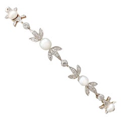 Antique 1.42 Carat Diamond and Natural Pearl Yellow Gold Bracelet, circa 1910