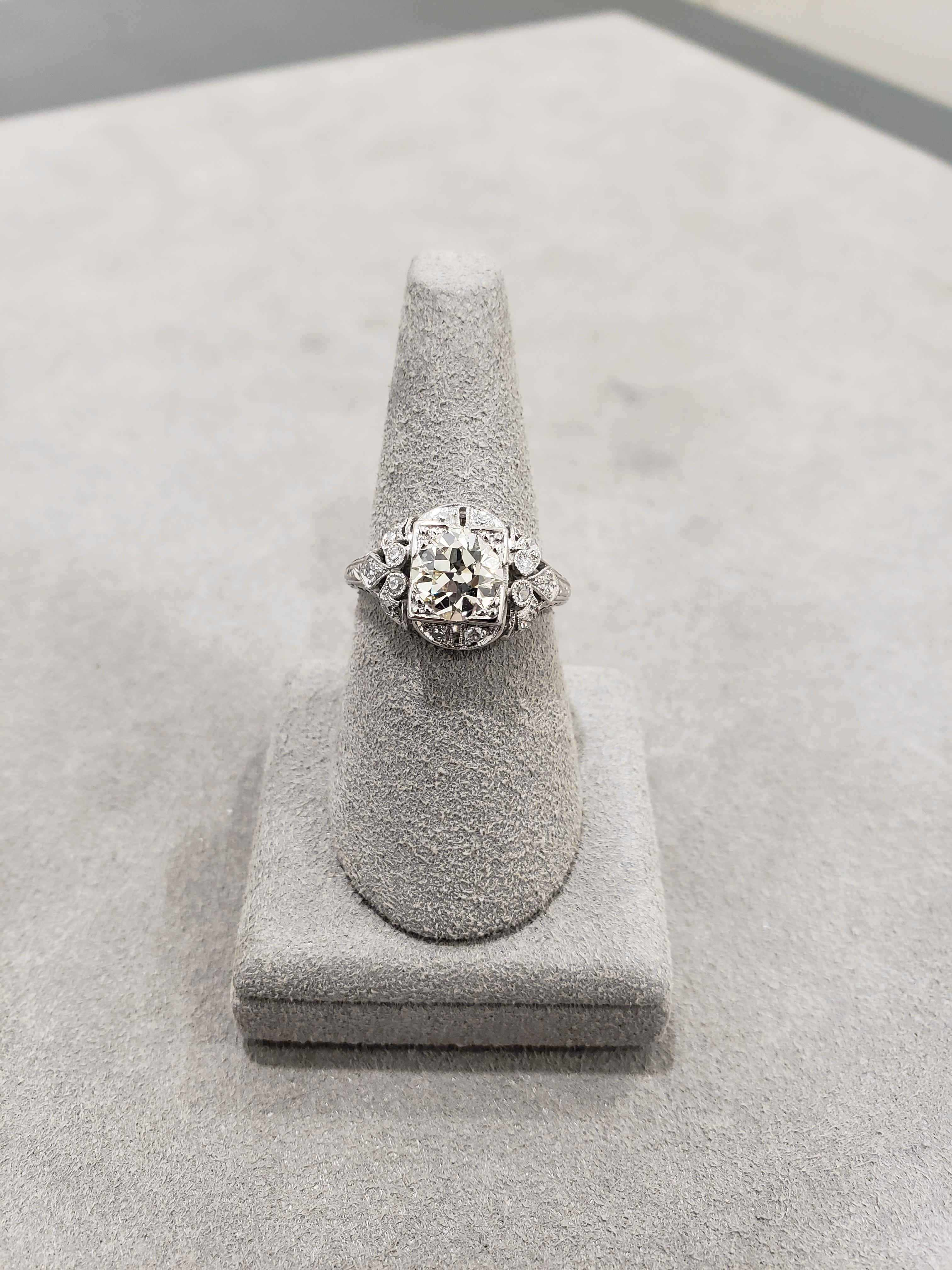 An Old-European Cut Diamond weighing 1.42 carats is spotlighted in this antique engagement ring. Set in an intricately-designed and handcrafted band accented with 0.22 carats total of diamonds. Size 7 US.

Style available in different price ranges.