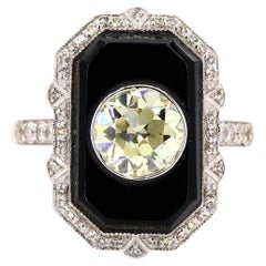 Bague ancienne en or avec un diamant rond taille brillant de 1,42 carat et de l'onyx