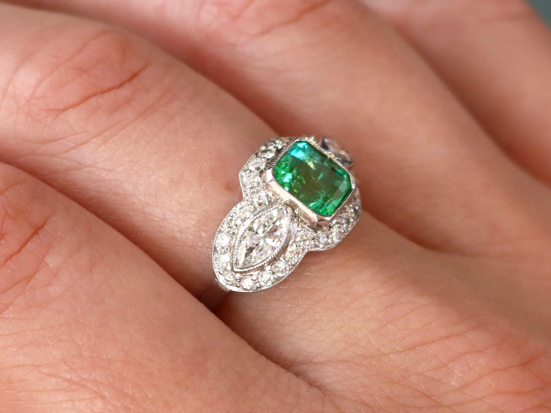 A stunning, fine and impressive antique 1.45 carat emerald and 1.43 carat diamond, platinum dress ring; part of our diverse antique jewelry collections.

This stunning, fine and impressive antique emerald and diamond ring has been crafted in