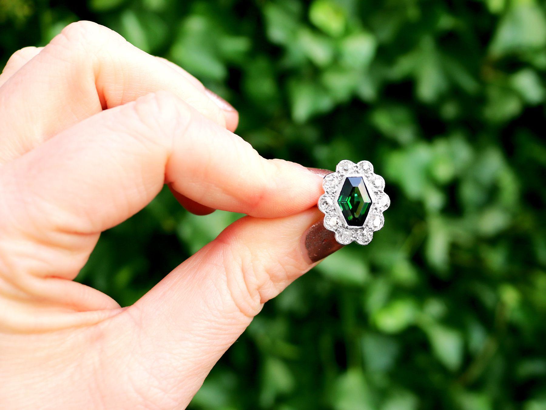 A stunning, fine and impressive 1.45 carat green tourmaline and 1.96 carat diamond, 18 karat white gold cocktail ring; part of our diverse antique jewelry and collections.

This stunning, fine and impressive antique gemstone ring has been crafted in