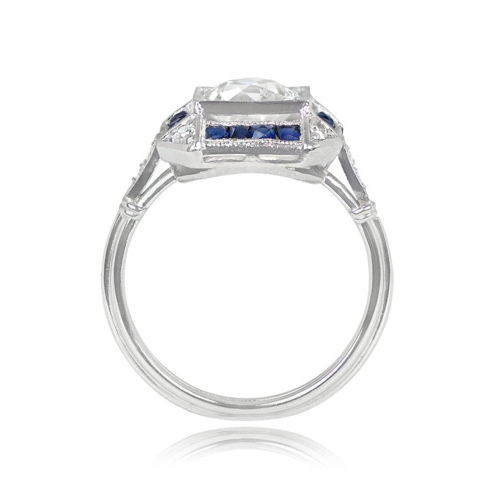 Presenting an exquisite Art Deco ring showcasing a mesmerizing 1.47-carat old European cut diamond, exhibiting a J color and VS1 clarity, nestled securely in prongs within a square bezel. Embracing the center stone is a halo of approximately 0.36