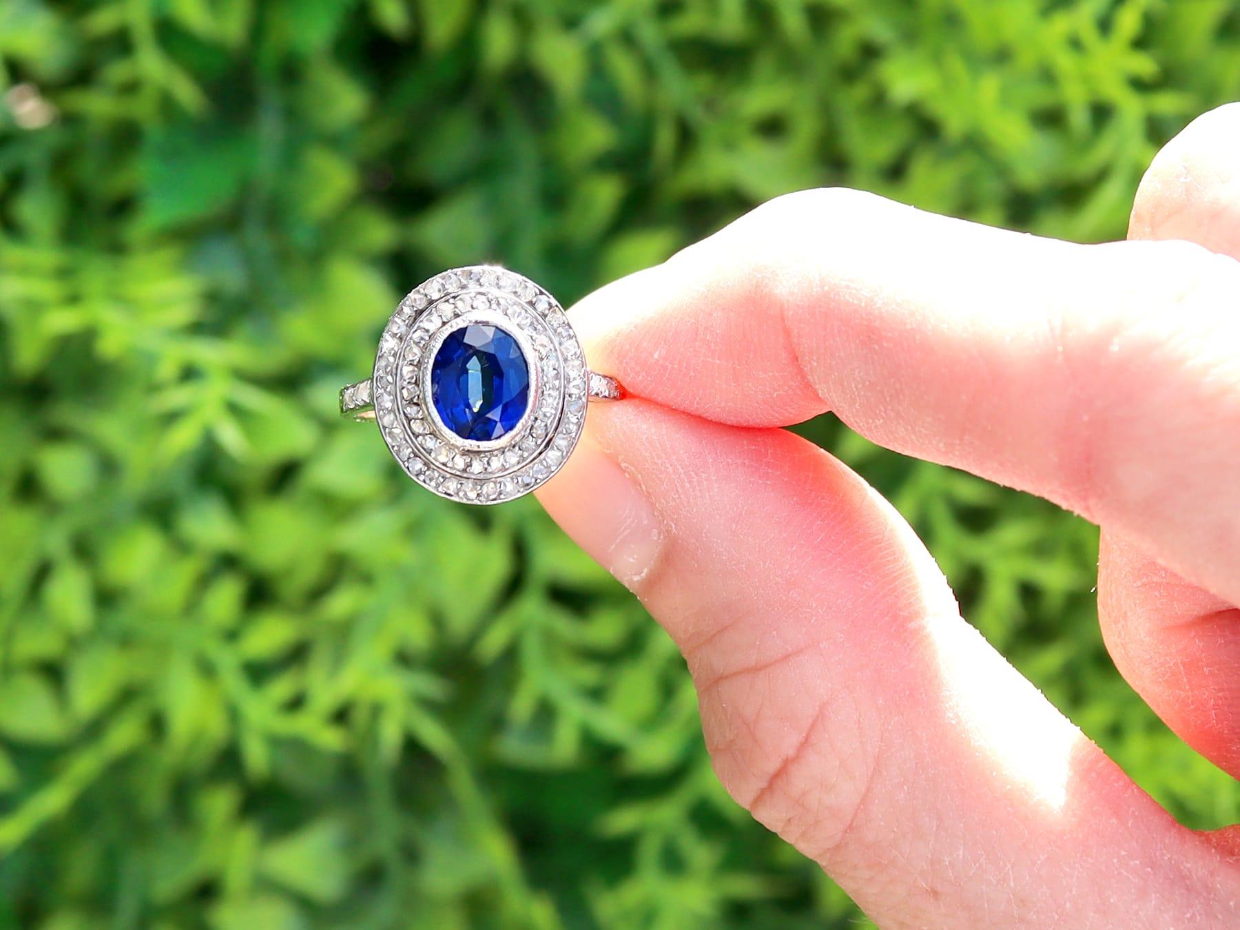 A stunning, fine and impressive antique 1.47 carat oval sapphire and 0.54 carat diamond, platinum cluster style dress ring; part of our diverse antique sapphire jewellery collections.

This stunning, fine and impressive oval sapphire ring with