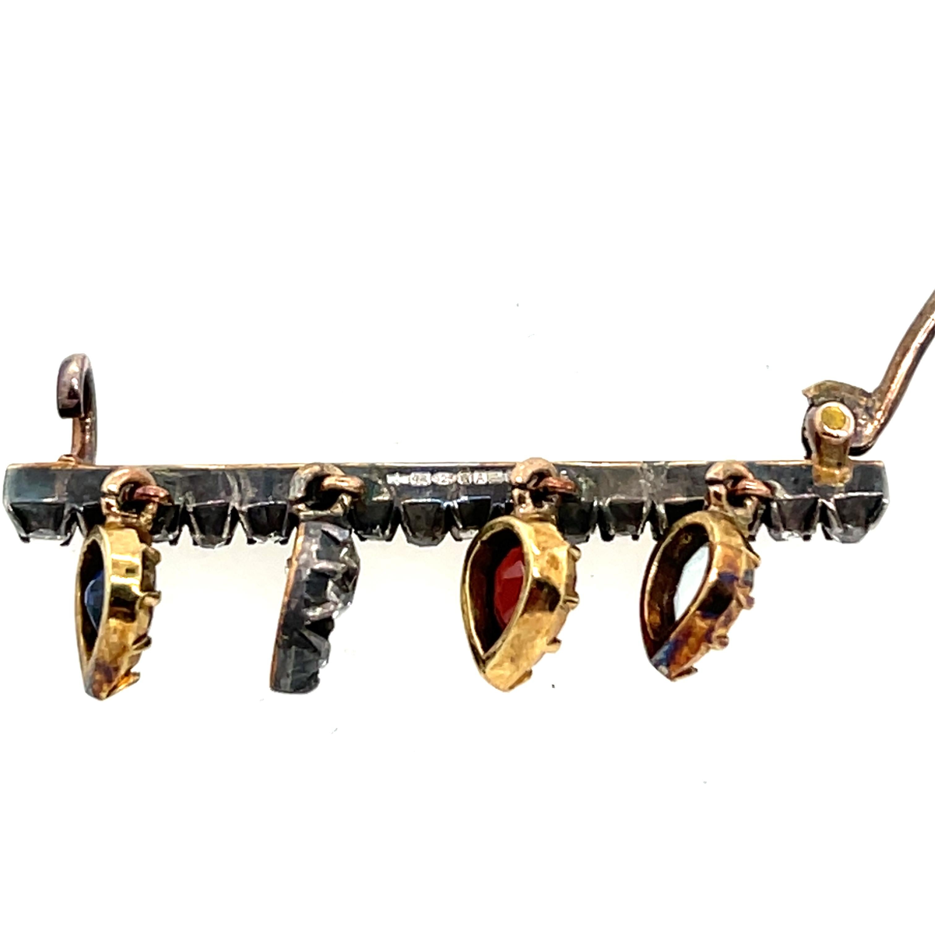 Taille ronde Broche ancienne en or et argent 14ct, sertie de saphir, grenat, aigue-marine et diamant en vente