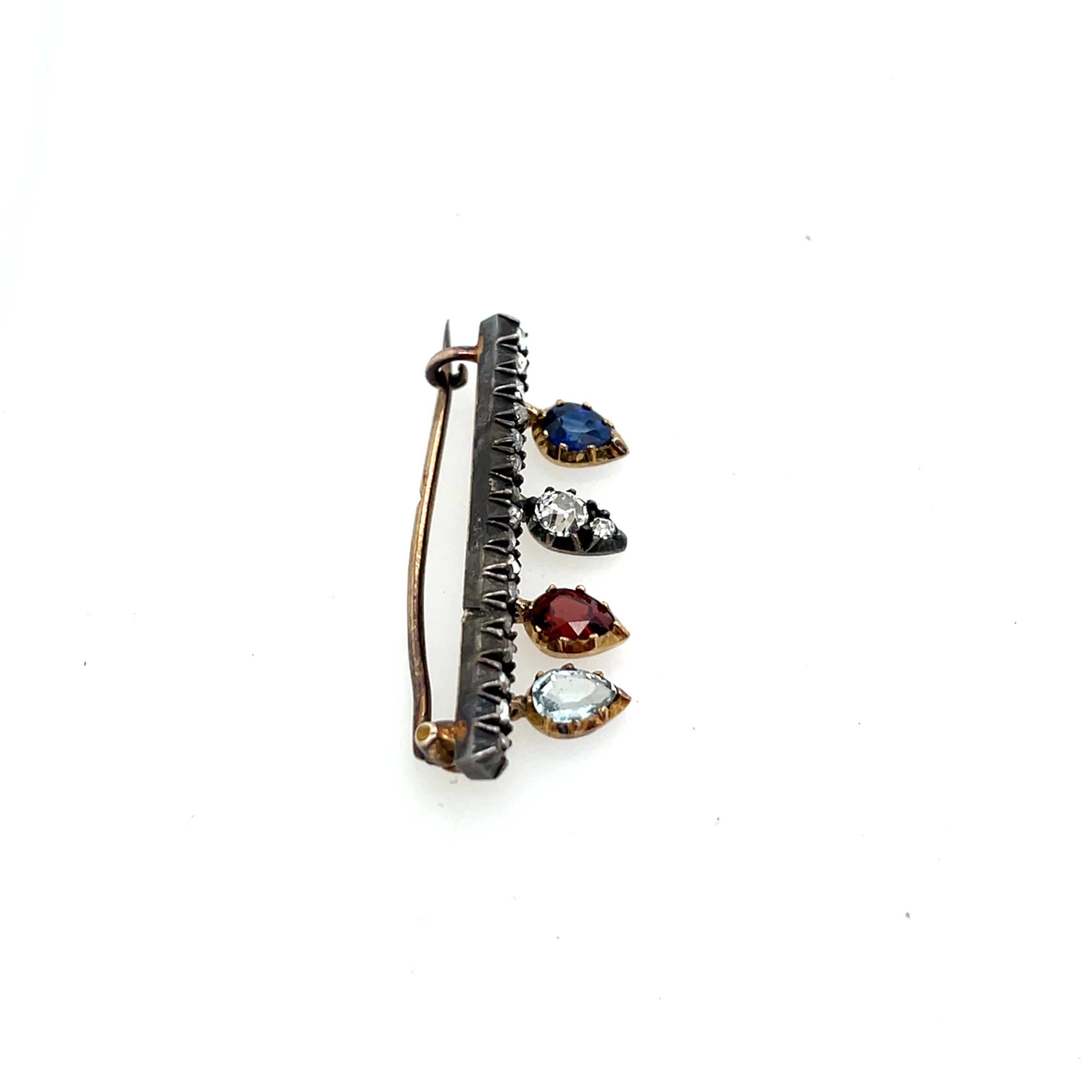 Broche ancienne en or et argent 14ct, sertie de saphir, grenat, aigue-marine et diamant Unisexe en vente