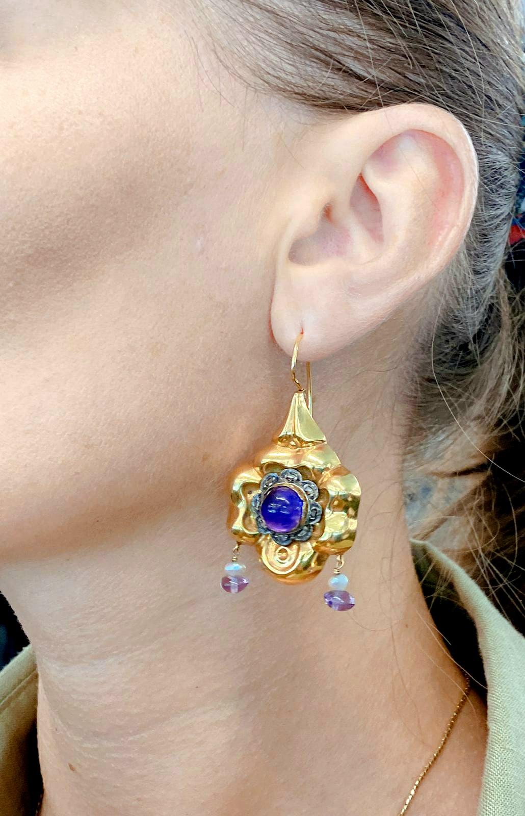 Antique amethyst earrings large in size centered with 2 natural pink cabochon amethyst flanked with rose cut diamonds and dangling pearls  in 14k gold settings with total gold weight of 16 grams and 5cm earrings lengh hall marked on the back with