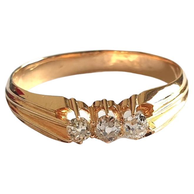 Antique 14k gold band ring centered with 3 old mine cut diamonds with estimate weight of 0.20 carats H colour vs cleariry in detailed work on ring setting hall marked 56 imperial russian gold standard ring was made during the imperial russian era
