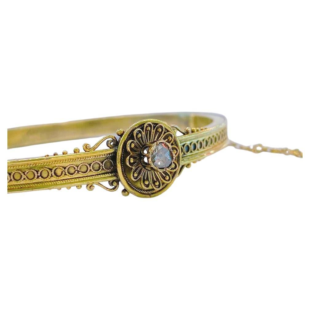 Antique 14k or astro hungerian era bangle bracelet in onrnaments workmanship details centered with a rose cut diamond bracelet a été fait dans la ville de vienne au cours de l'astro hungerian era 1880.c hall marked with letter A vienna assay mark