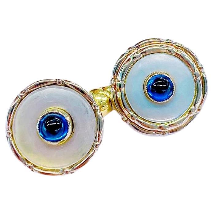 Antique 14k gold cufflinks with natural mother of pearls centered with natural blue sapphires cabouchon cut in 2 tone gold colour white and yellow with detailed workmanship dates back to europe 1917/1920.c hall marked on the back