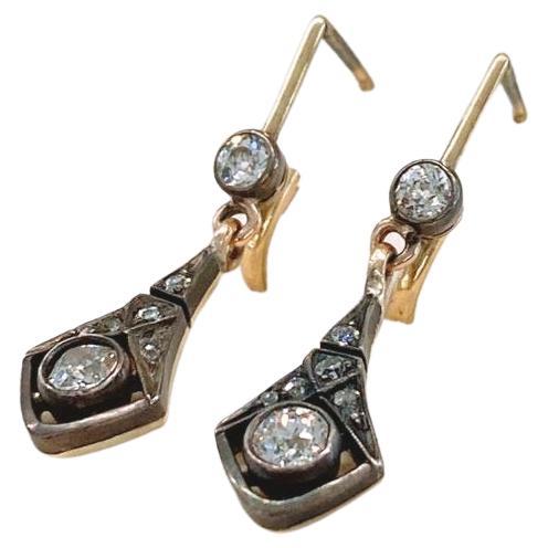 Antique 14k gold earrings topped with silver with old mine cut diamonds estimate weight of 1 carat in dangling artdeco style earrings was in moscow during the early soviet unioun era 1917/1920.c hall marked 583 soviet gold control and 875 silver