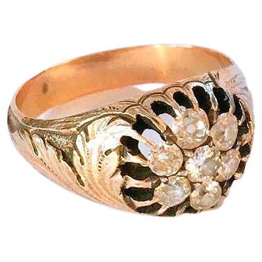 Antique 14k gold ring in unuswal detailed work of leafs designe on ring sides centered with old mine cut diamonds estimate weight of 1 carat ring dates back to the russian tsarist era 1907.c