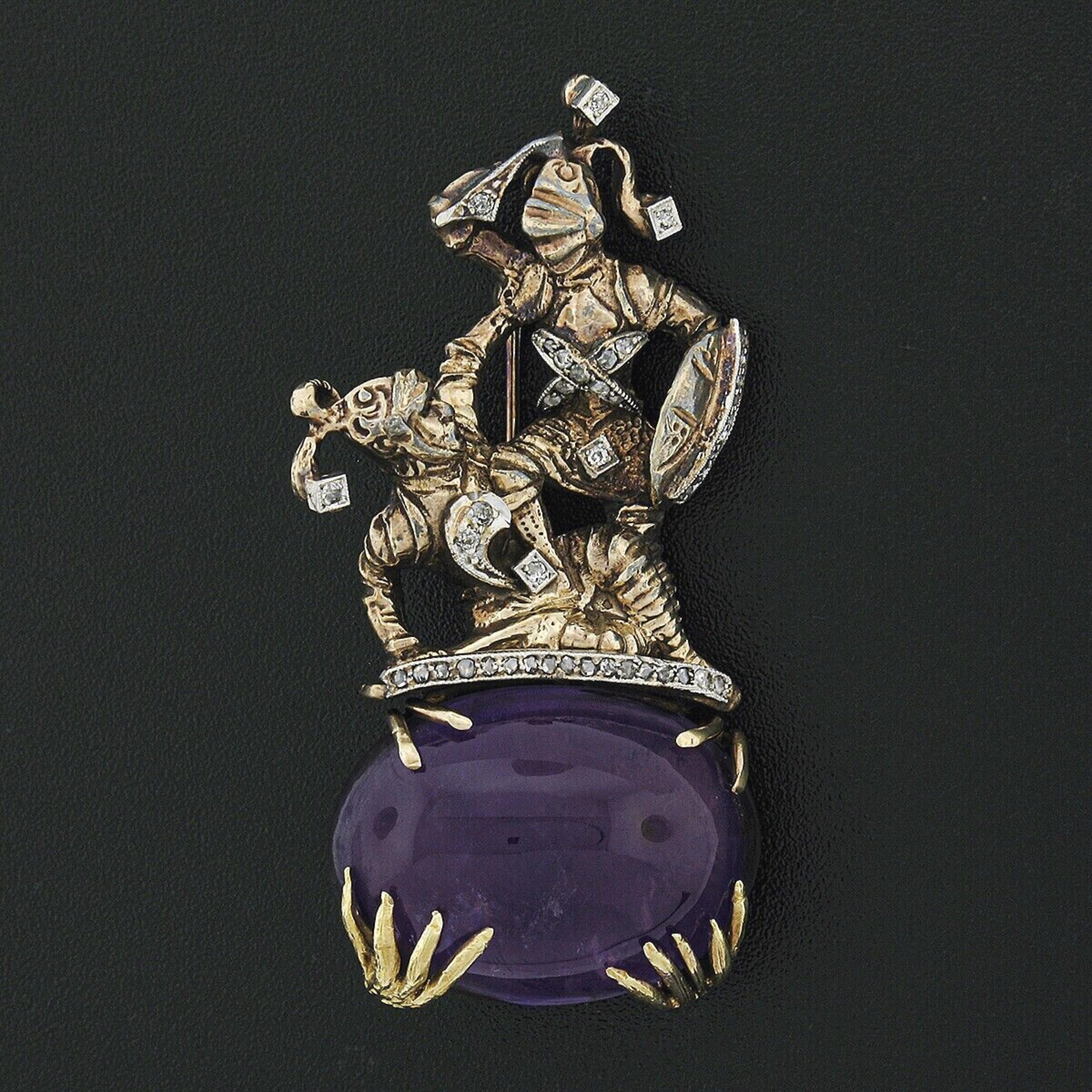 Here we have a super unique and truly magnificent antique brooch crafted from solid 14k yellow gold and platinum featuring two incredibly detailed knights fighting on top of a beautiful oval cabochon cut natural amethyst stone. The knights exhibit