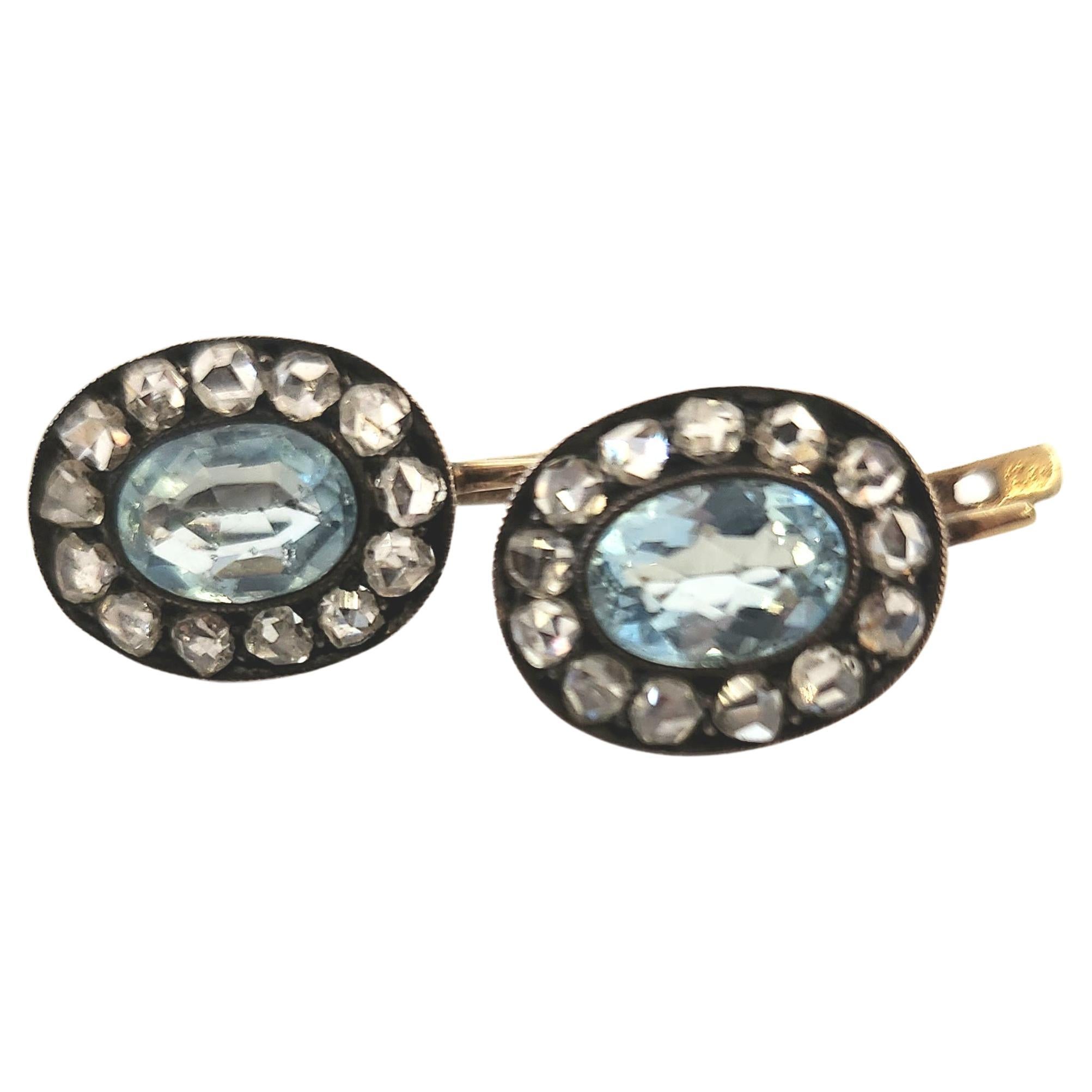 Antique russian earrings centered with light blue oval cut aqua marine stone with a diameter 7.30mm flanked with rose cut diamonds with estimate weight of 0.60 ct earrings head diameter 13mm in 14k gold setting  topped with silver was made in moscow