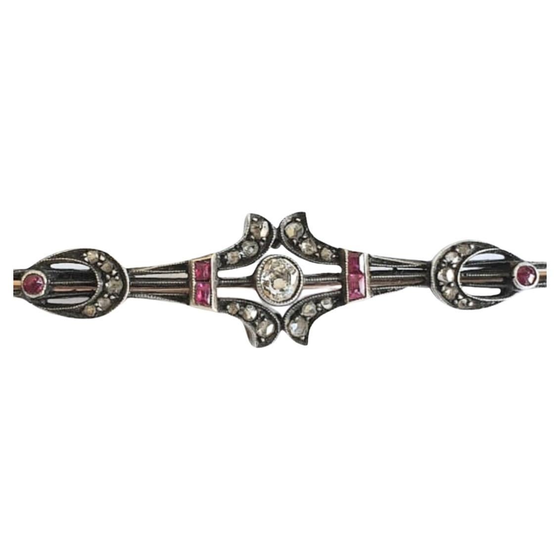 Antique russian large brooch in 14k gold topped with silver with old mine cut diamonds estimate weight of 0.50 carats and natural rubies total brooch lenght 9cm was made in moscow during the imperial russian era 1907.c hall marked 56 imperial