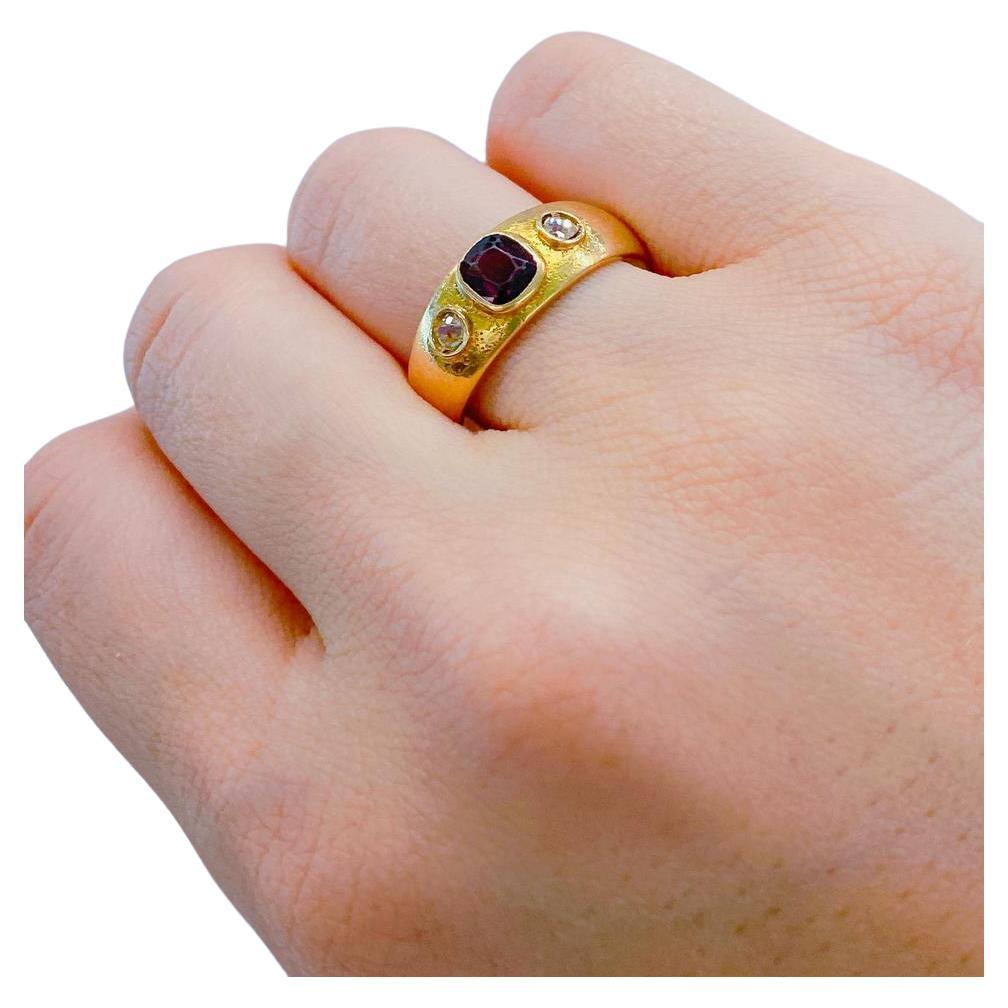 Antique russian ring centered with 1 natural garnet flanked with 2 old mine cut diamonds estimate weight of 0.20 ct in 14k gold setting ring was made in the early soviet era 1920.c hall marked with 583 soviet control mark total ring weight 7 grams 