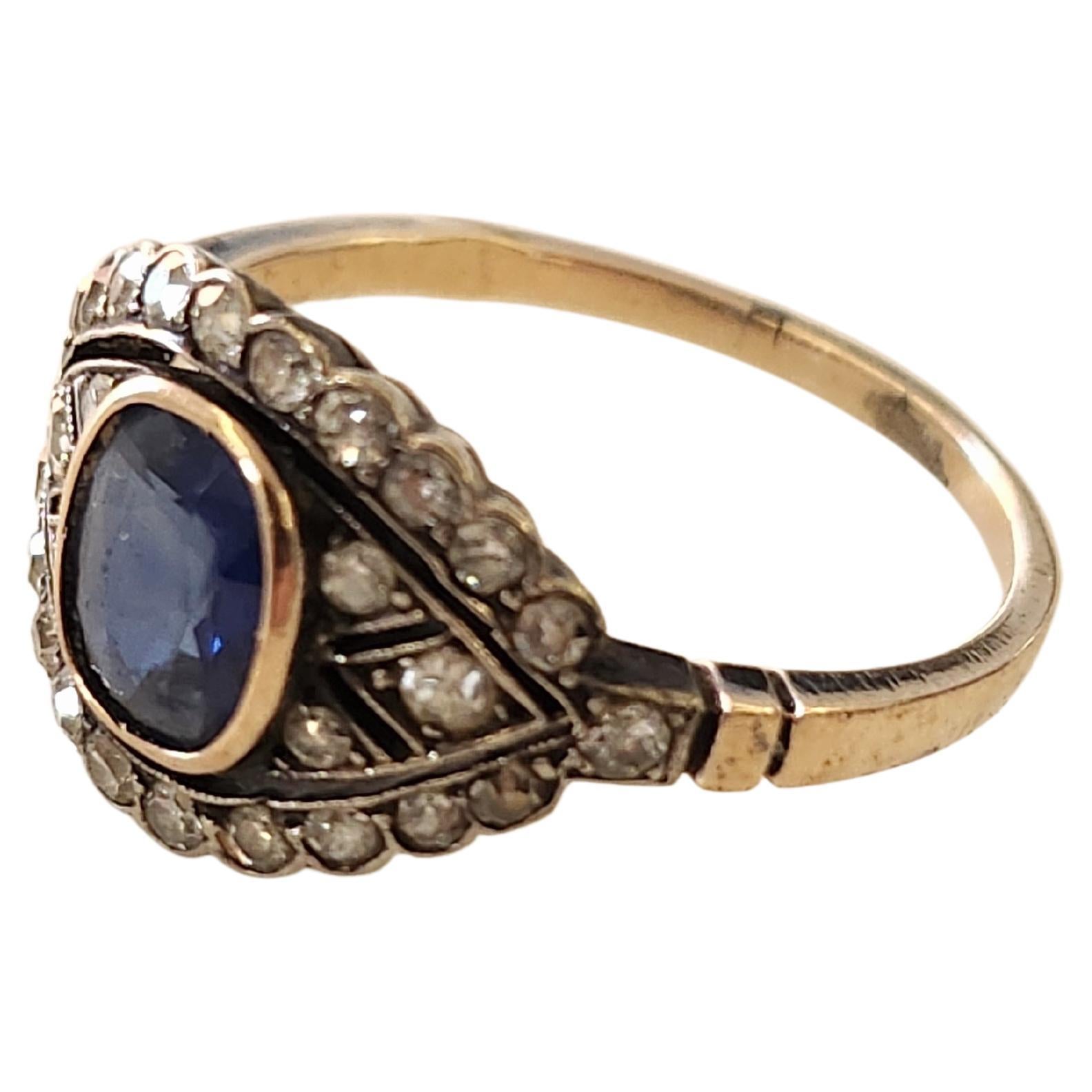 Antique 14k gold russian ring centered with 1 natural blue sapphire in oval cut with a diameter of 7.85mm×6.80mm flanked with several single cut diamonds estimate weight of 0.60 ct ring is hall marked 56 imperial russian gold standard and later with