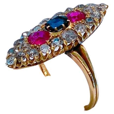 Antique 14k gold ring in naviet style centered with natural sapphire rubies and old mine cut diamonds ring head diameter 2.8cm hall marked 56 imperial russian gold standard ring dates to the imperial russian era 1917.c