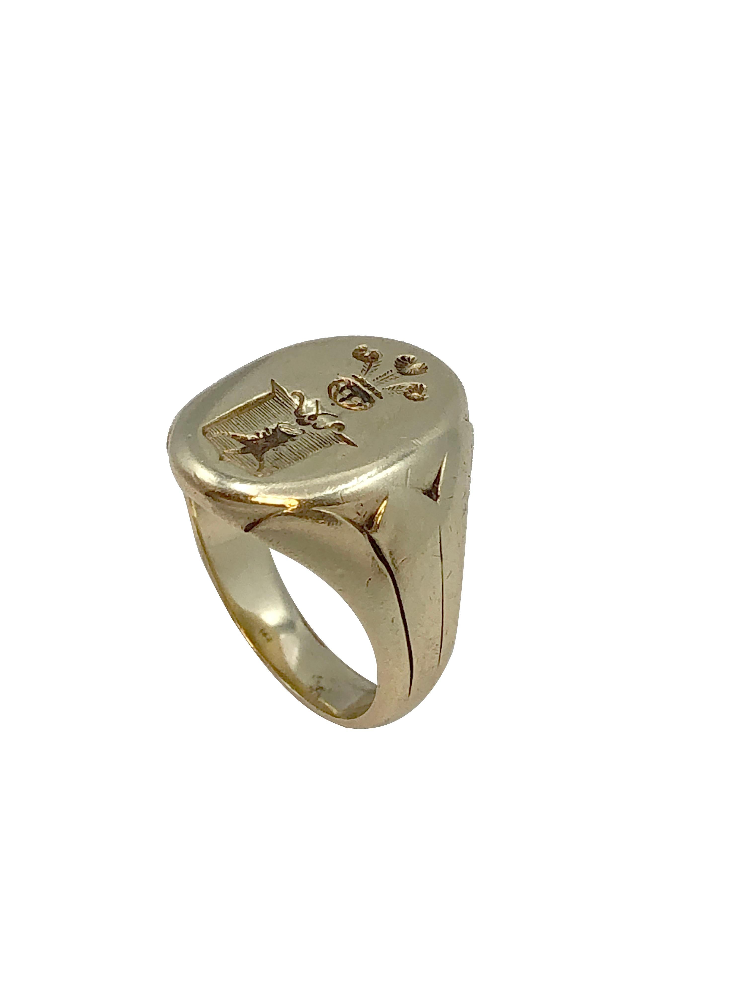 Circa 1920 - 1940 14k Yellow Gold Signet ring, the top of the ring measures 5/8 X 1/2 inch and has a deep carved Intaglio signet / Crest. The ring weighs 12.8 Grams and is a finger size 7. 