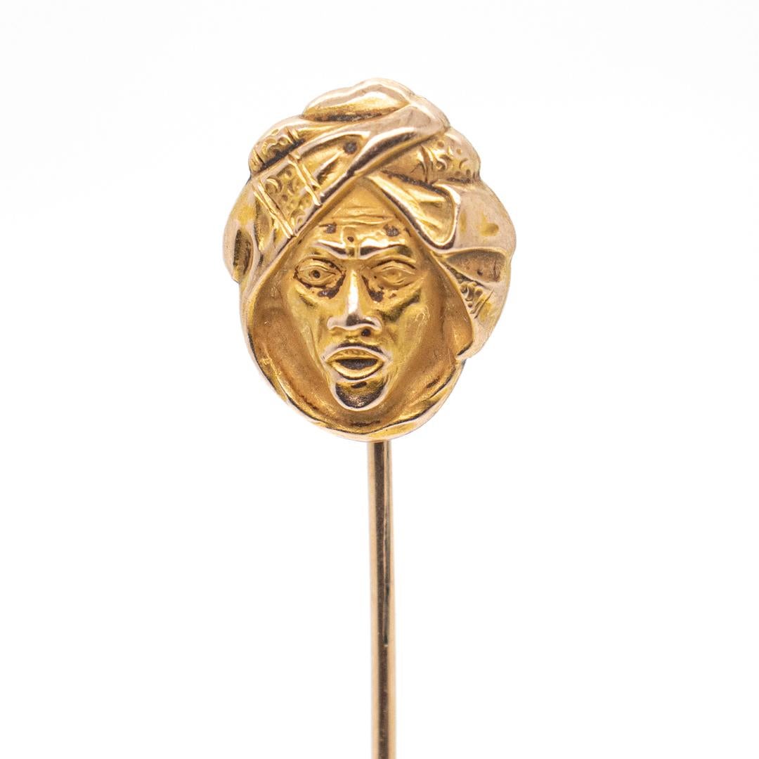A fine antique stick pin

In 14k gold.

Depicting the bust of a North African or Arab man with a turban headdress.

Simply a wonderful Ethnographic stick pin!

Date:
Early 20th Century

Overall Condition:
It is in overall good, as-pictured, used