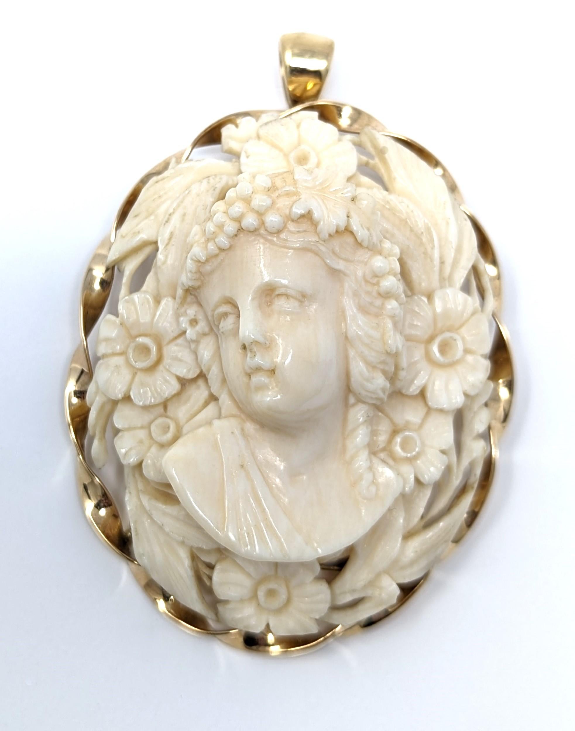 Stunning antique high relief hand carved bone cameo, set with an elegant twisted rope border in 14k solid yellow gold. Can be worn as either a pendant or as a brooch, makes for a wonderful conversation piece! This piece is beautifully detailed and