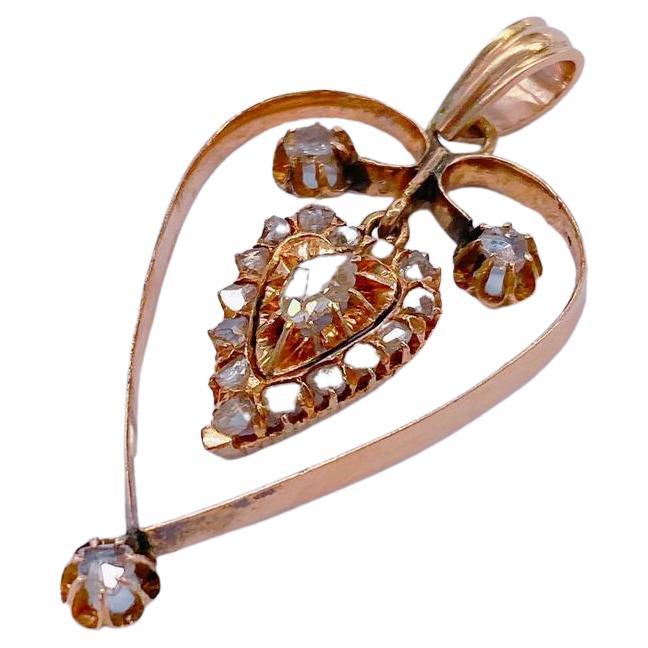 Antique 14k gold large heart pendentif in open work style with rose cut diamonds estimated weight of 1 carat un foiled back 4cm lenght pendentif was made in the cocaus region during the imperial russian era 1904/1907.c hall marked 56 imperial
