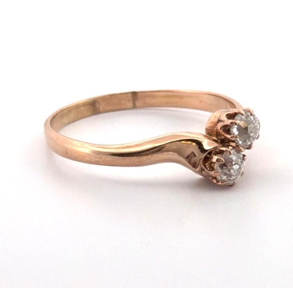 Antique Old Mine Cut Diamond Bypass Ring – 14K Rose Gold – Size 9.75

🡆 Description:
Offered is an antique two-diamond bypass ring crafted in warm rose gold, featuring a romantic crossover design with two early Old Mine Cut diamonds set in