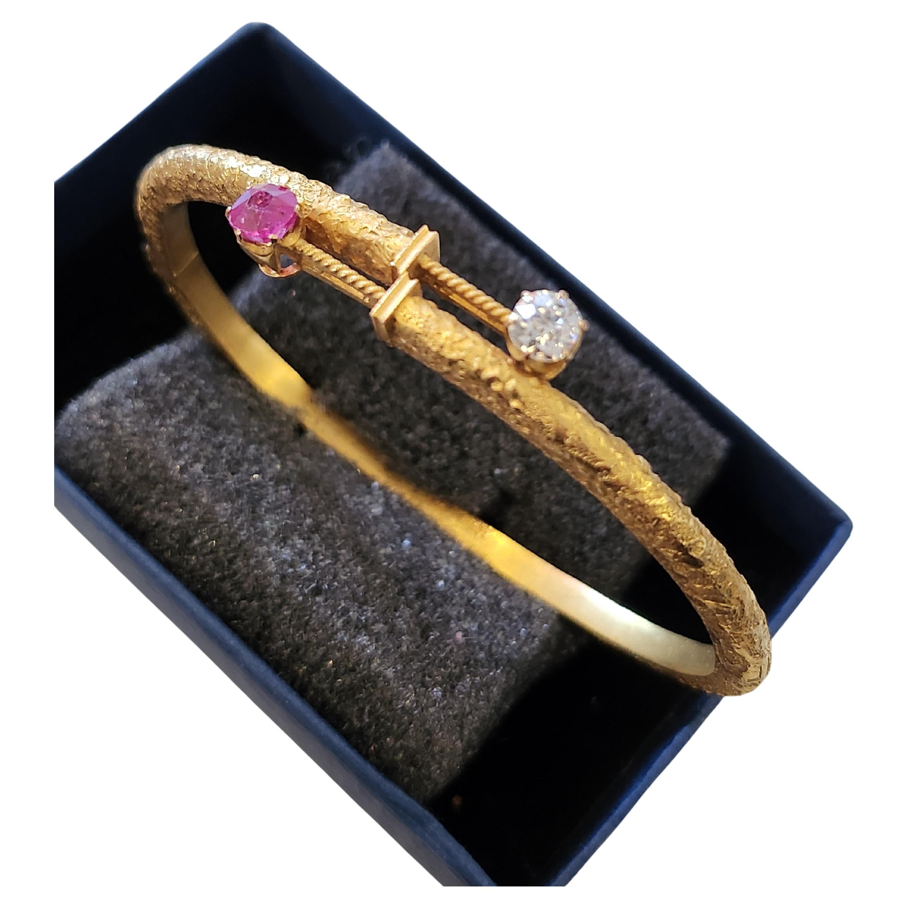 Antique russian cuff braclete in scrubed 14k gold style centered with 1 natural ruby and 1 old mine cut diamond braclete was made in st petersburg 1899.c imperial russian era braclete width 6.5 cm and total gold weight of 9 grams hall marked 56