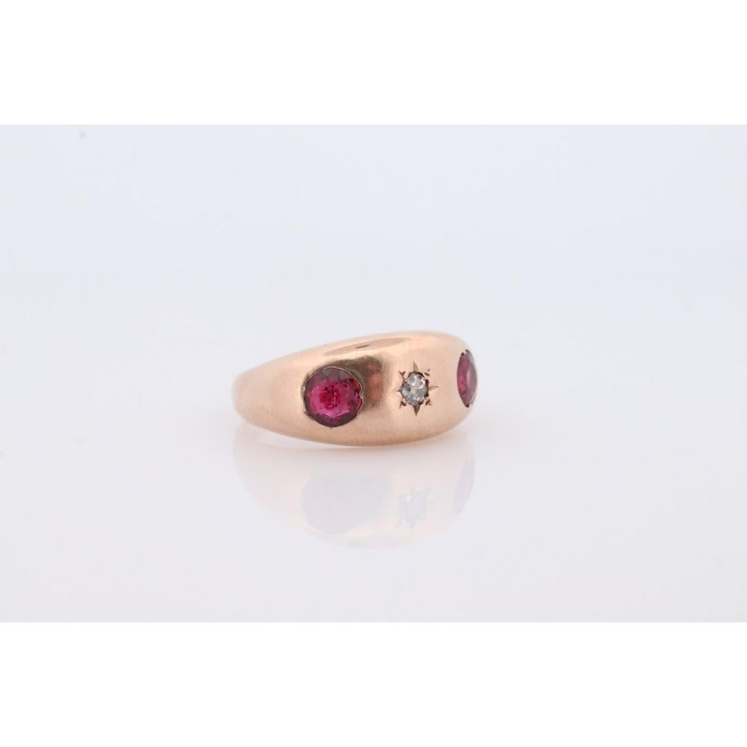 Vintage from the 1910s
Size: 6 US
Materials: Gold
Gemstone: Ruby
Gem color: Colorless

Style: Minimalist

Very unique Mens or Womens ring/band. Triple gem with Rubies and Diamond set into signet style ring. Will look spectacular worn on any