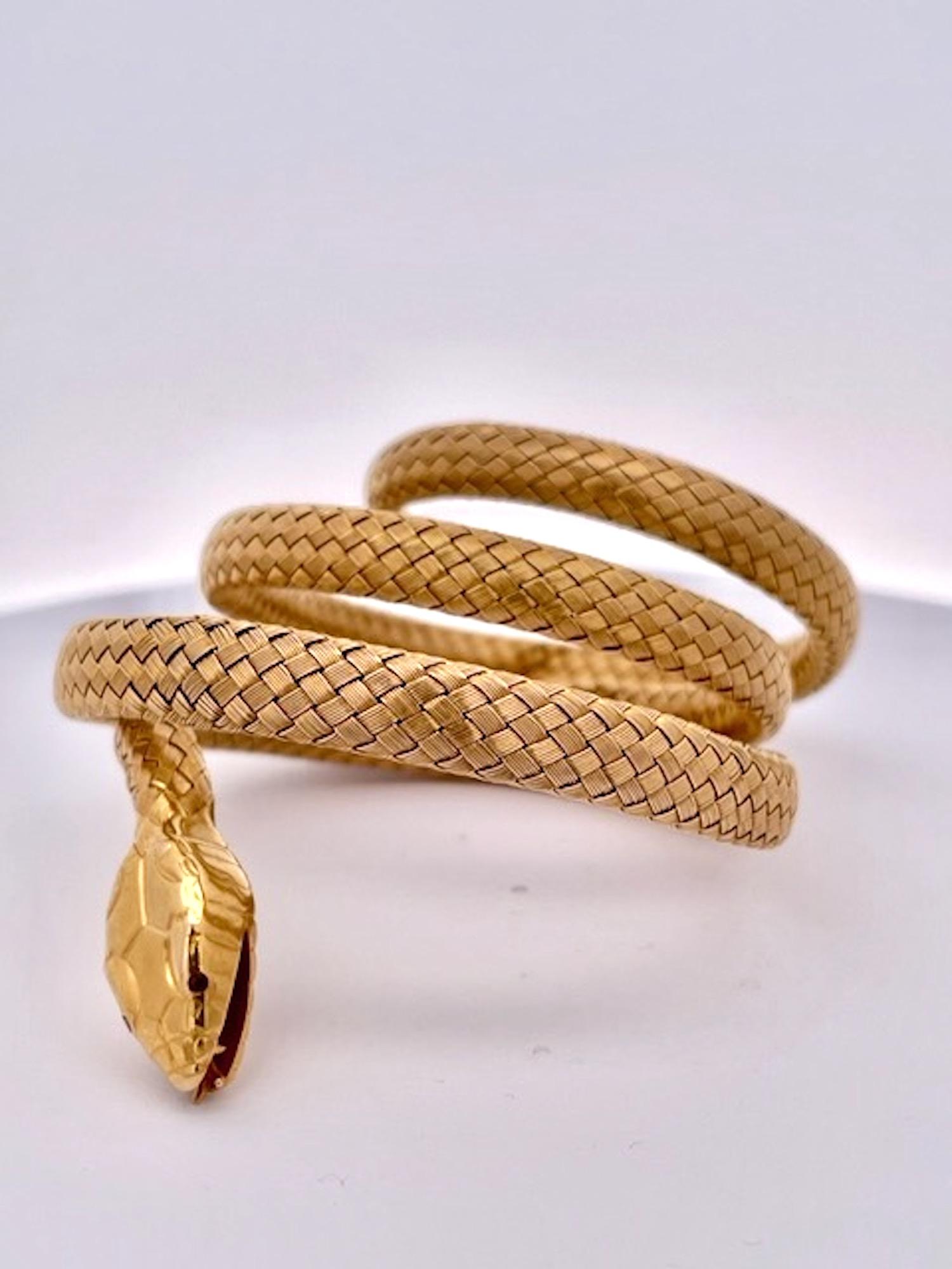 This triple wrap snake bracelet is circa 1900 and is in amazing shape.  This bracelet is wrapped and braided gold and fits any size wrist.  The flexibility of this bracelet is something I have never seen as it wraps beautifully around the wrist no