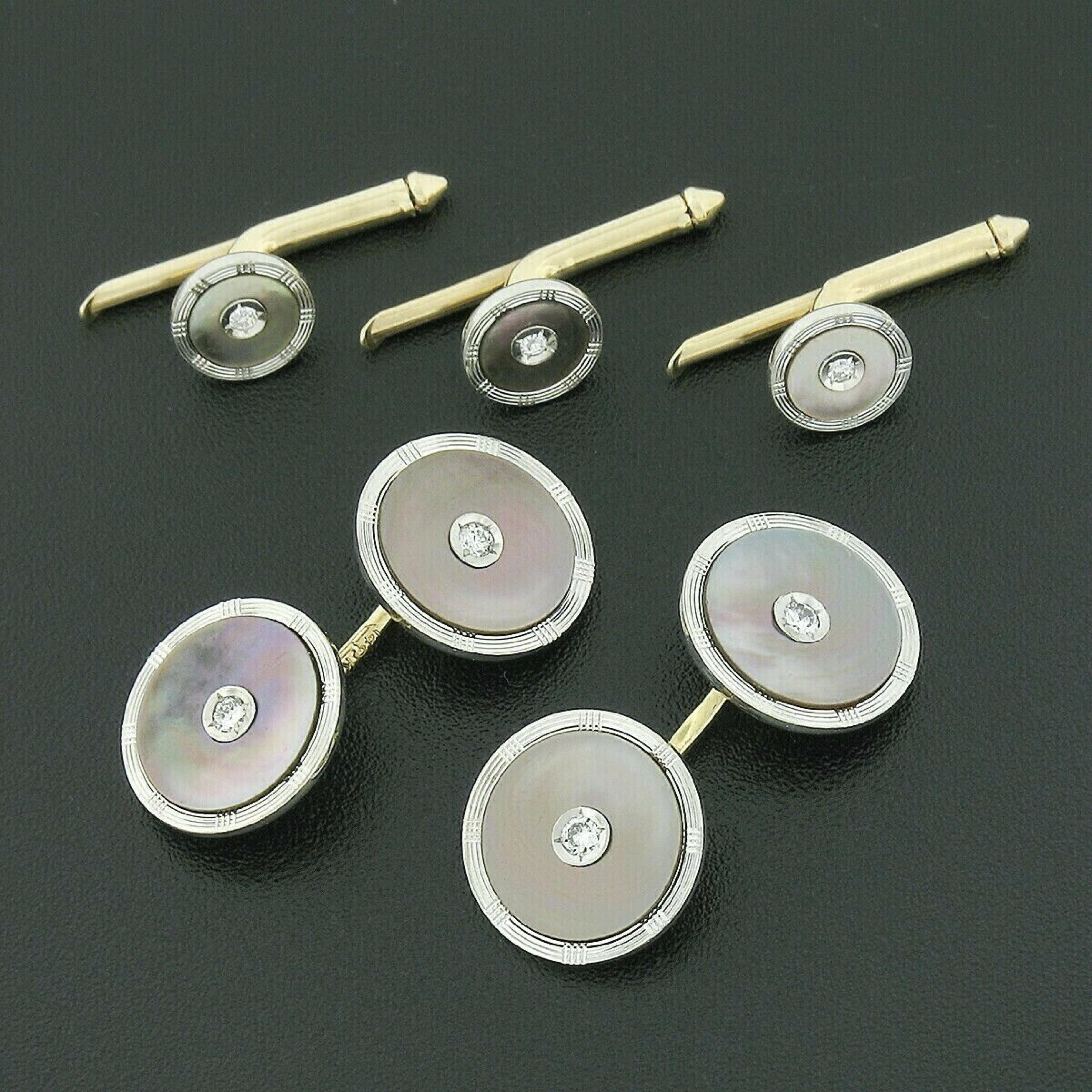 Here we have an antique set of men's cuff links and button studs that was crafted from solid 14k yellow gold with a white gold top during the art deco period. The set features a round shape with an old European cut diamond neatly set at their center