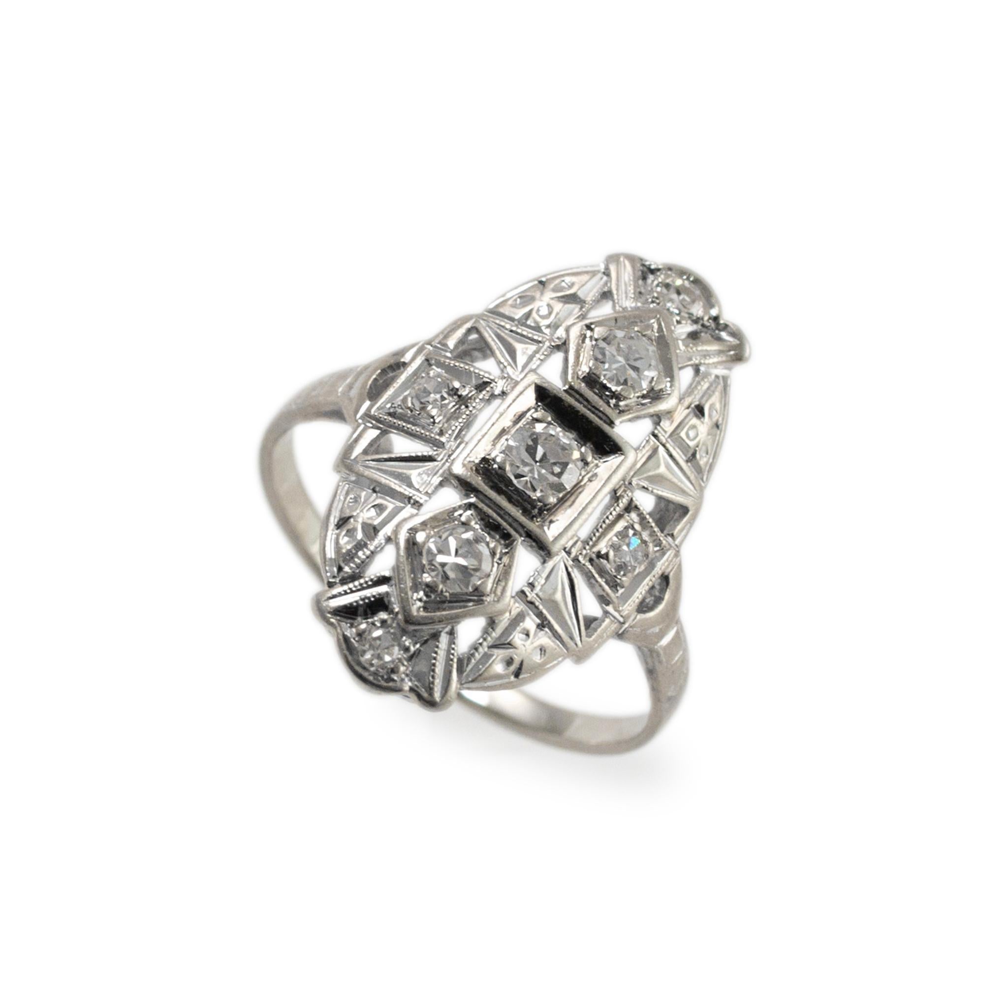 Gender: Ladies

Metal type: 14K White Gold

Ring Size: 3.5

Width: 19.00 mm

Weight: 1.83 grams

One ladies 14K white gold diamond antique cocktail ring with a half round shank. The metal was tested and determined to be 14K white gold. Engraved with