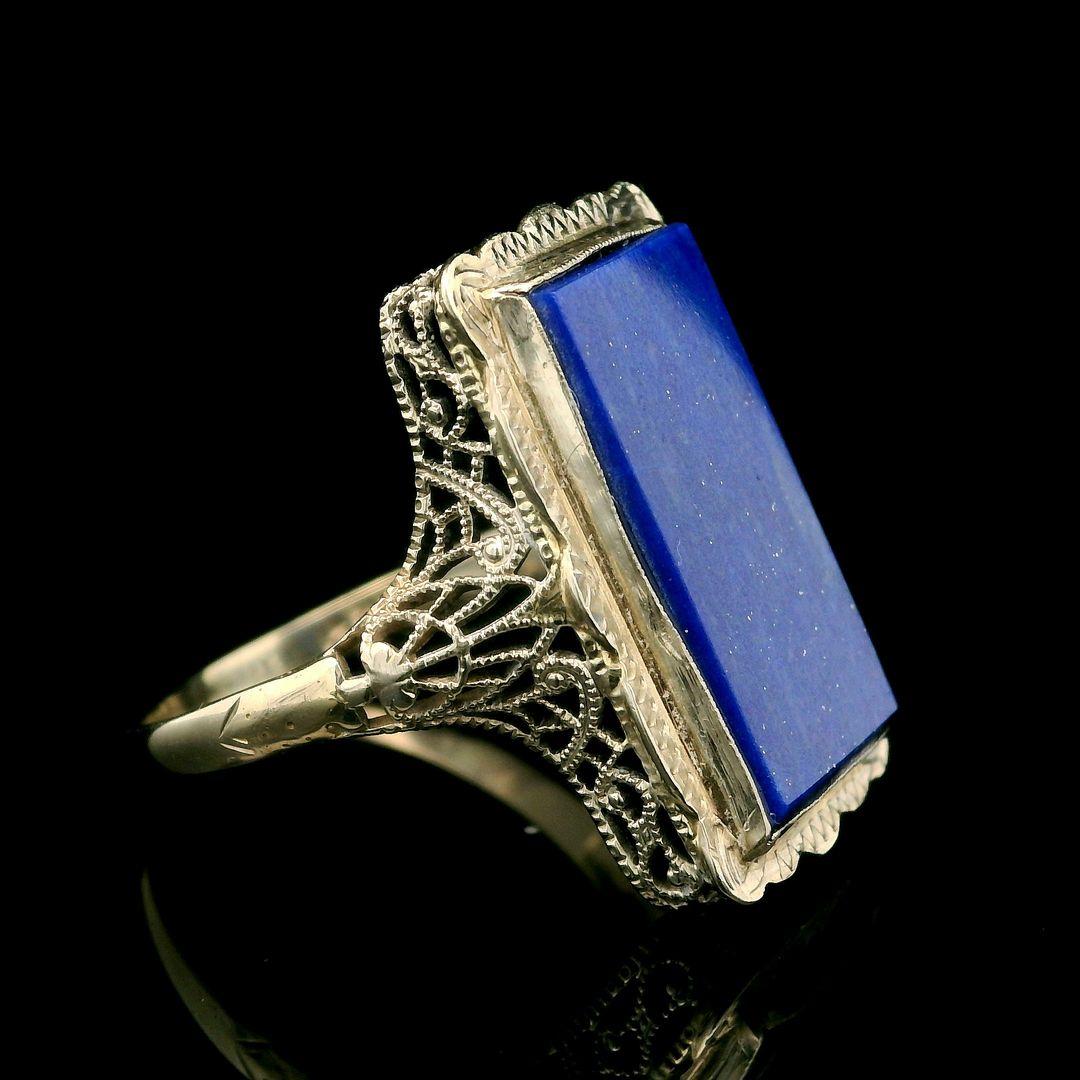 –Stone(s)–
(1) Natural Genuine Lapis - Rectangular Cut - Bezel Set - Cobalt Blue Color  - 17.4 x 9.04mm (approx.)
Material:  14k White Gold
Weight: 3.26 Grams
Ring Size: 8.5 ( fitted on finger, please contact us prior to purchase with sizing