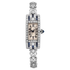 Antico orologio a carica manuale da donna in oro bianco 14 carati e platino con zaffiro blu e diamanti