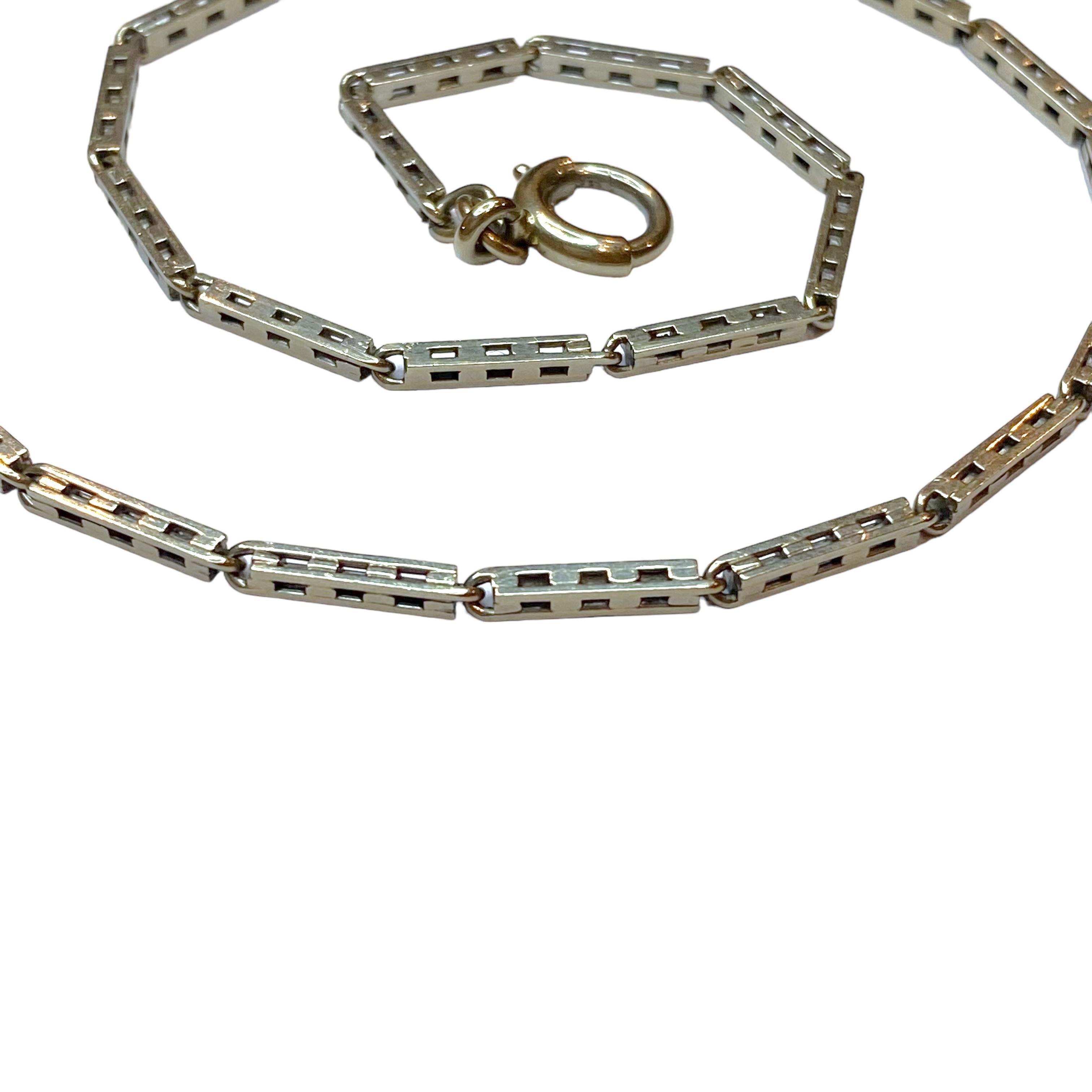 Antique 14K white gold watch fob, composed of a series of pierced long bar links.
Measurements:
Length: 13.25 inches
Link width: 1.8 mm
Weight: 8.9 grams
Marked: 14K