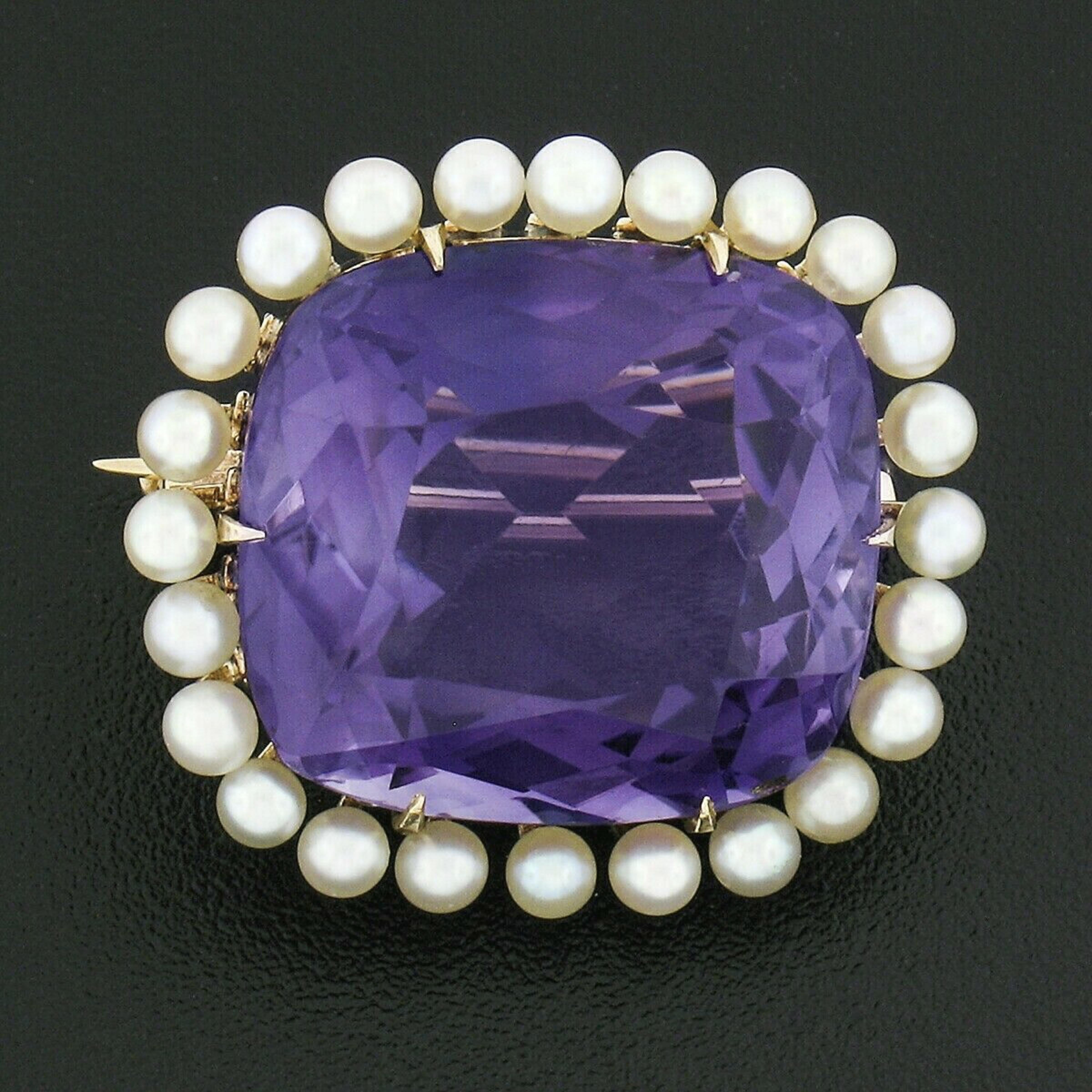 This is a truly beautiful antique pin brooch that was crafted during the 1920's from solid 14k yellow gold and features a gorgeous cushion cut amethyst neatly set at the center surrounded by a lovely seed pearl frame. The large amethyst is