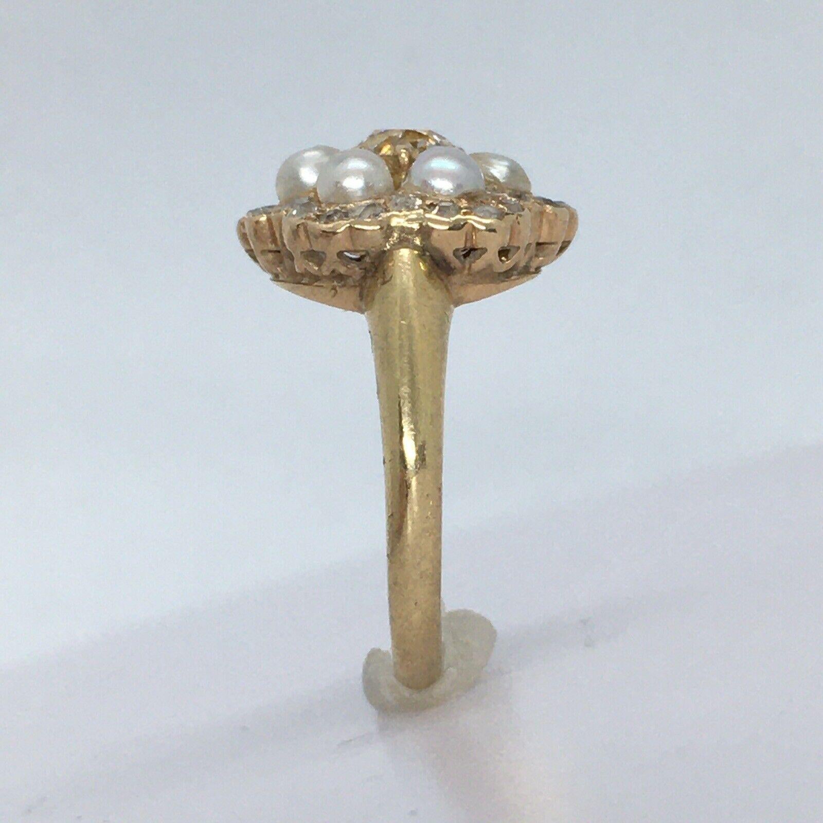 
Antique 14K Yellow gold 3/4 Carat Diamond Pearl American  Ring Size 6

Ower 100 Yrs of age
 Size 6
 Center Diamond 5.2-5.3 mm diameter & 3.3 mm deep, a little more than 1/2 Carat Old Cut Diamond 
24 pieces of Single Cut diamonds .01 carat each,